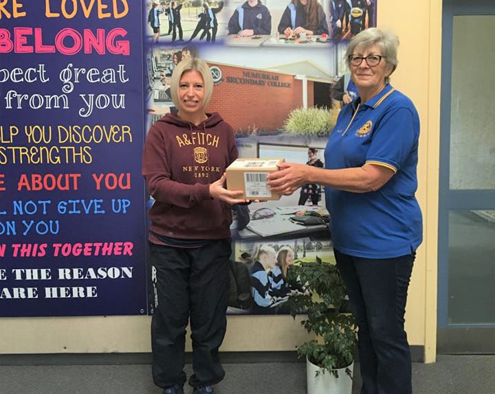 All donations gratefully received ... Cassandra Willis from Numurkah Secondary College receives the L’Oreal packs from Rotary Club of Numurkah’s Kaye Moodie. 