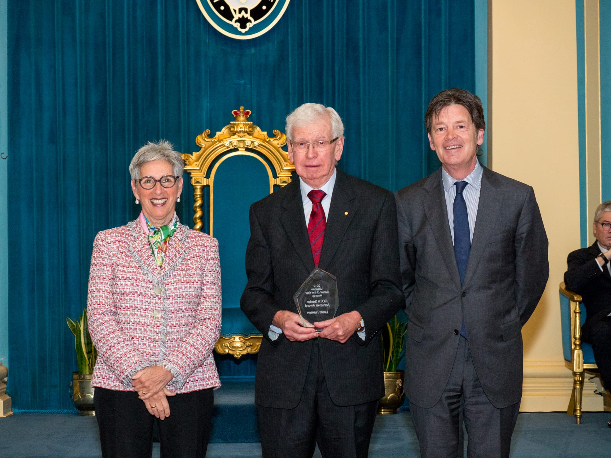 Humble ... Lou Hamon at the awards ceremony with Victorian Governor The Honourable Linda Dessau and Minister for Ageing Luke Donnelan.