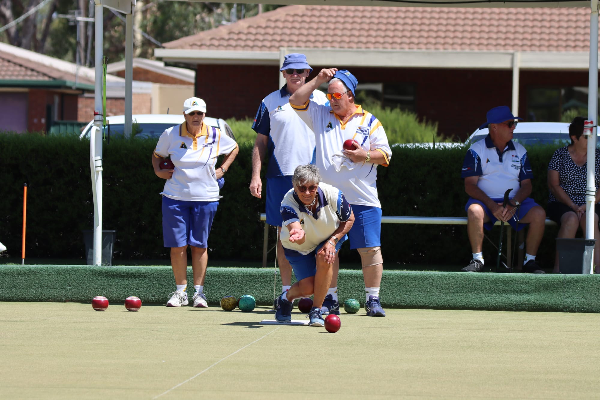 Three in a row ... Frank Houlihan keeps a close eye on Lidija Patching’s shot, as Gary Roulston gets ready to have his shot.