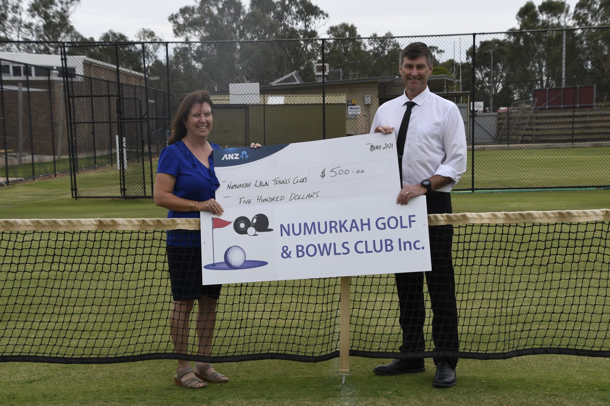 Good sports... Numurkah Lawn Tennis Club treasurer Narelle Page gratefully accepts a donation of $500 from Numurkah Golf and Bowls Club assistant manager Kevin Morland. 
