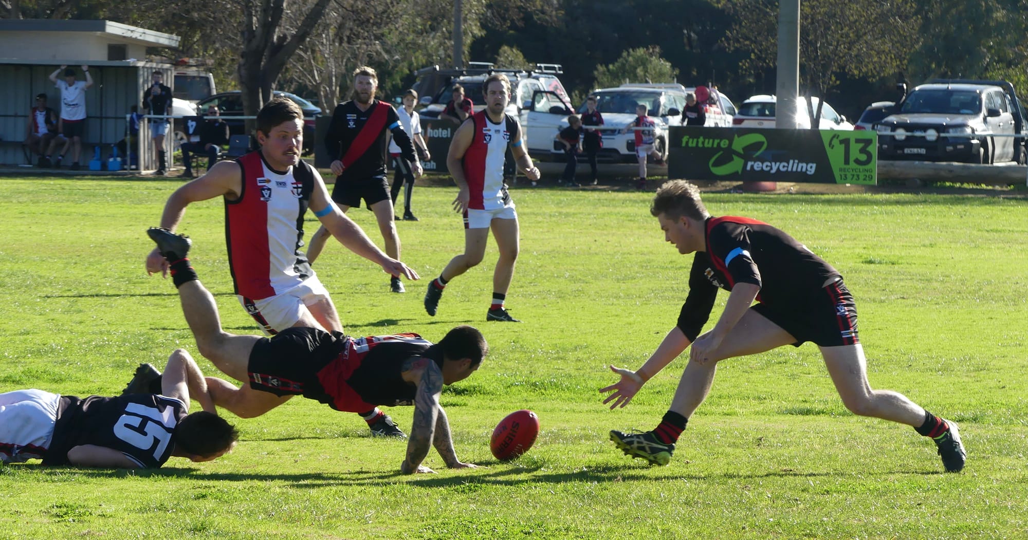Desperation ... Ash Thompson (left) dives for the ball with Jesse Trower in assistance. 
