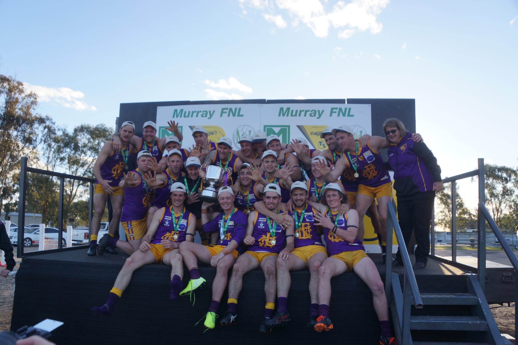 Winners are grinners … Nathalia seniors celebrate their premiership win.