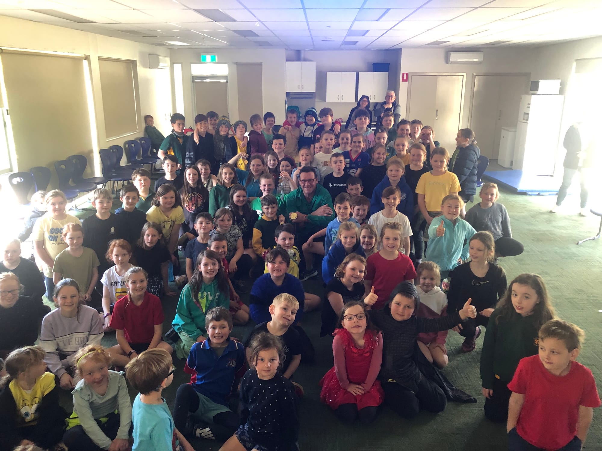King of the kids... Olympic gold medallist Andrew Cooper was a huge hit with the whole   of Strathmerton Primary School at their Olympic event last Friday. 
