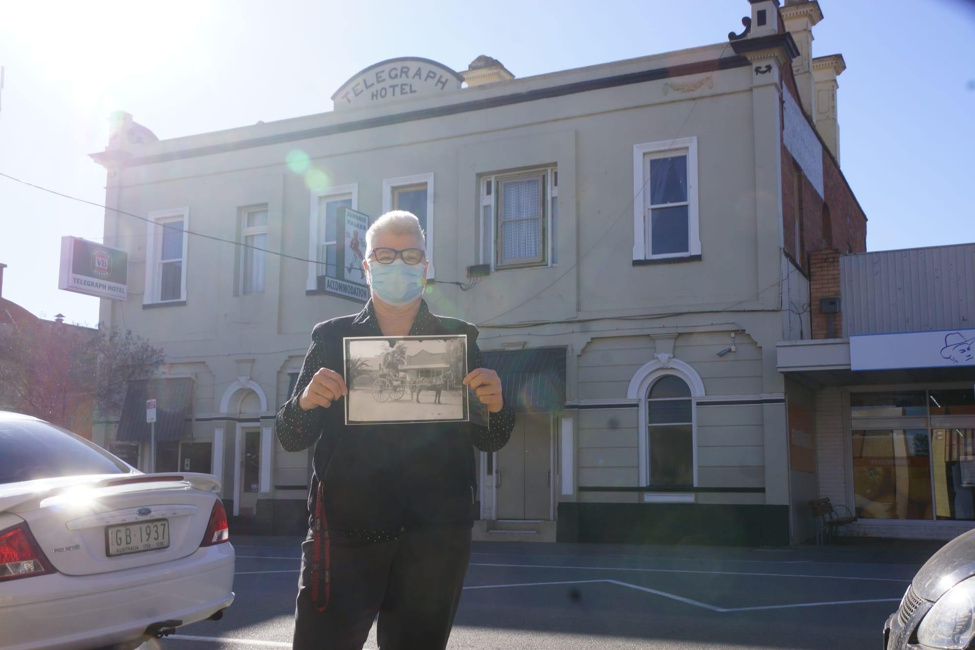 Mystery ... Telegraph publican Viv Morris with the historical photo printed from the negative found between the floorboards.

