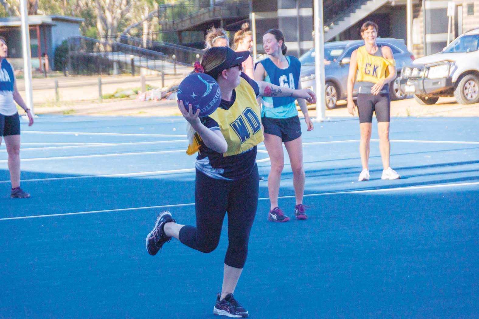 Passing off balance ... Danielle Beekman sends a one-handed rocket pass across the court. 