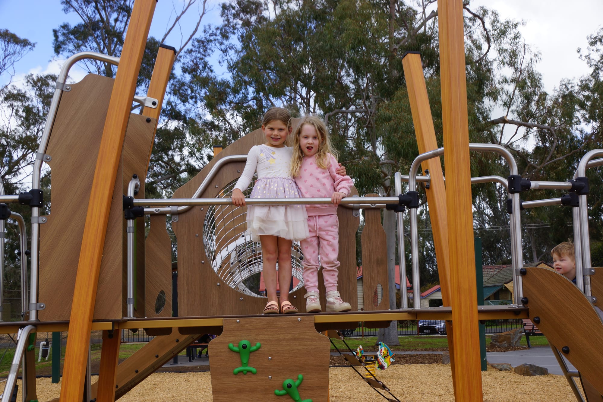 Friends in play... Brydie Lawless and Dylan McPherson couldn’t be happier with the new playground.
