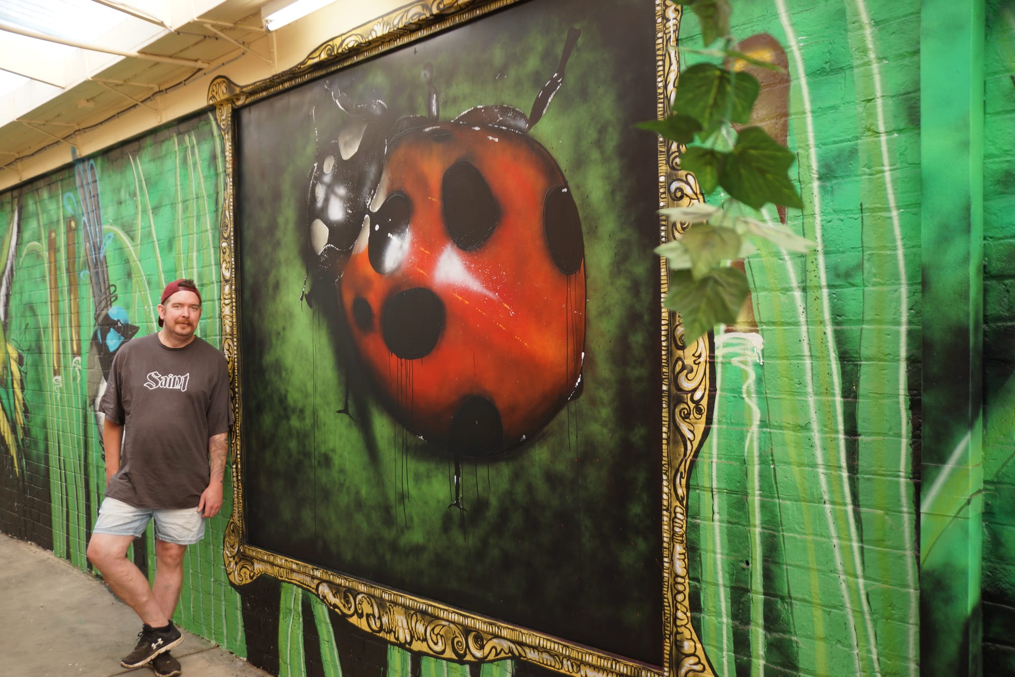 Focal point ... Cafe Mierlo owner Adam Drust is thrilled with the completed mural.