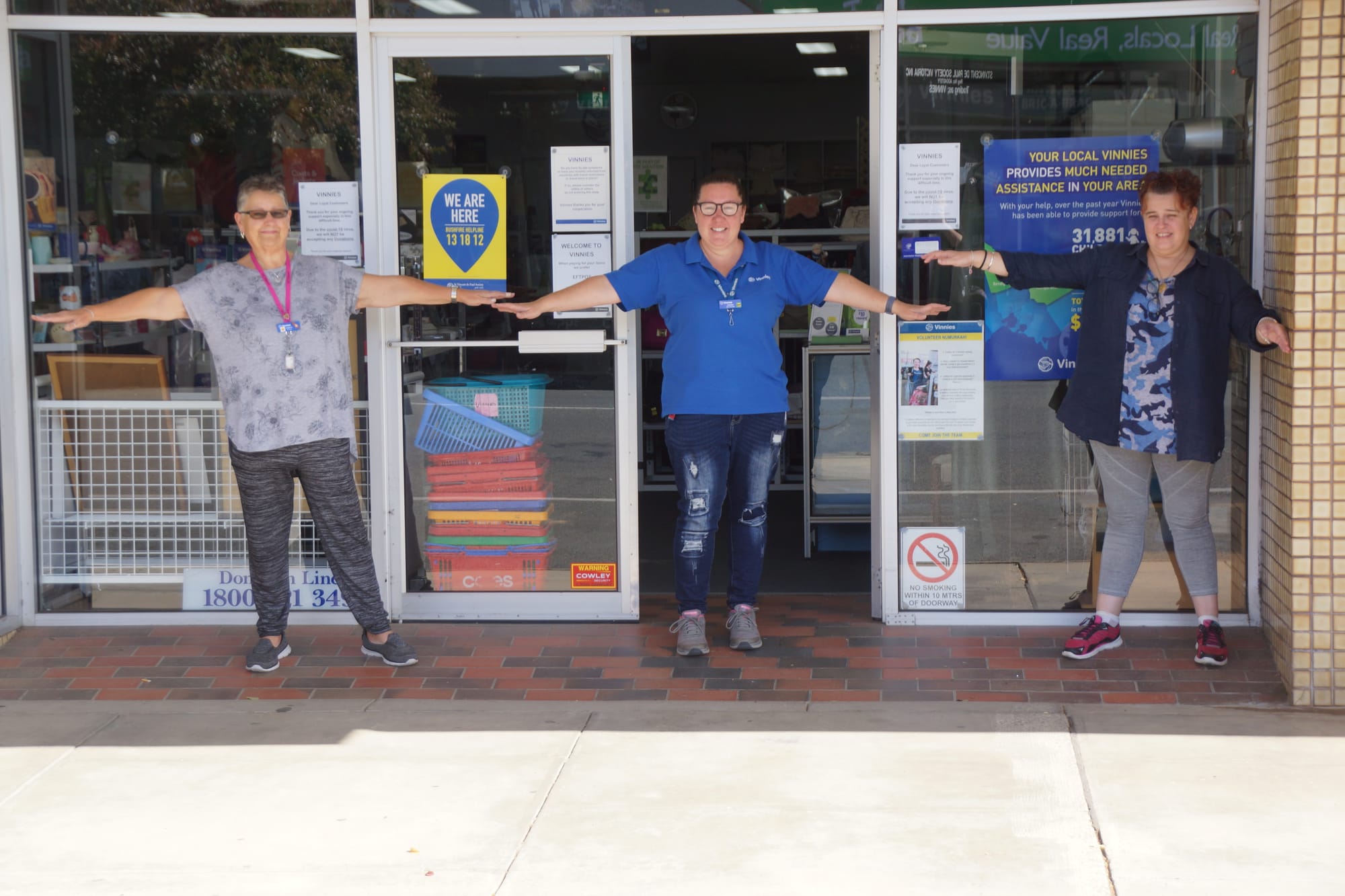 Still open at a social distance ... (From left): Cheryl Stockdale, Shona Spokes and Jodie Stockdale man a very much open Vinnies op-shop.