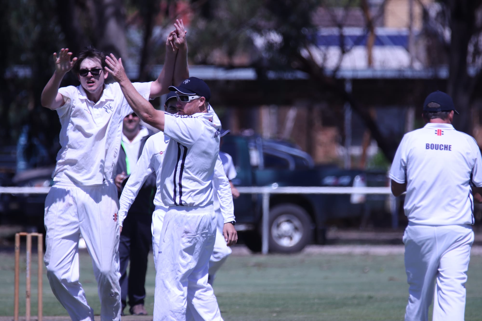 Another one gone … Hamish Lambert and Jason Verhoeven celebrate a wicket.