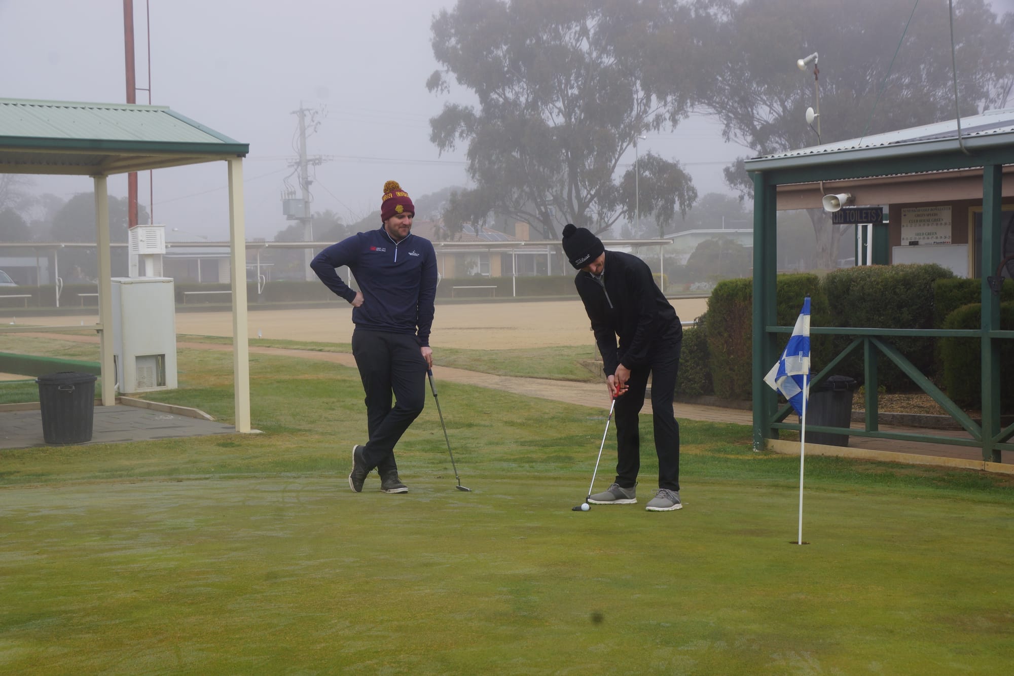 Pole position .... Dylan Grandell watches as his partner Jye Warren practises his putting before the start of the Jack Roche fourball.