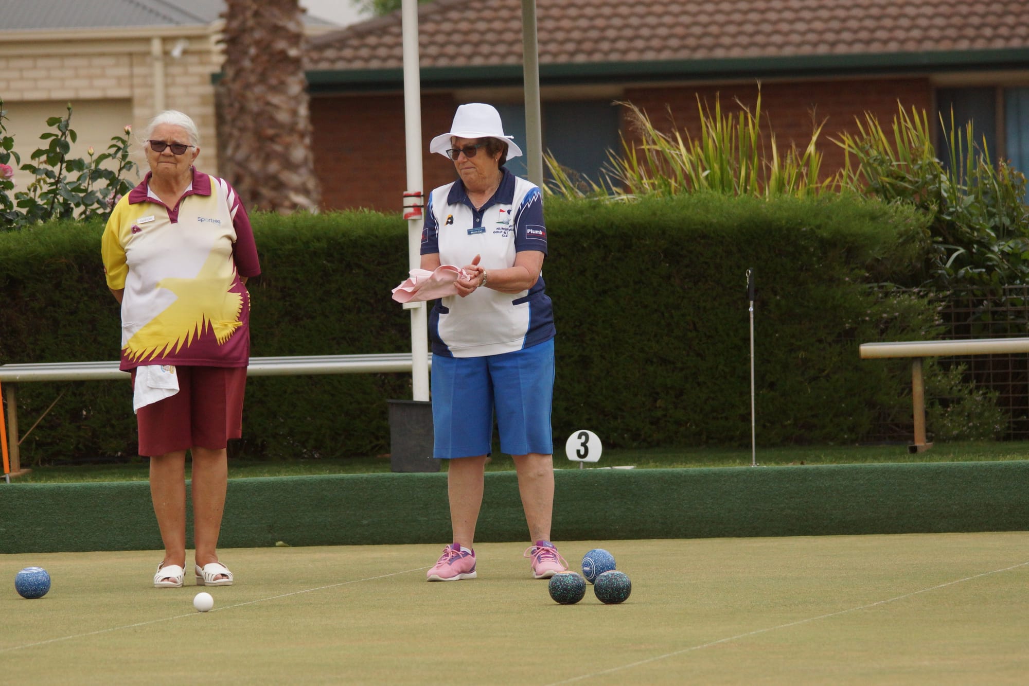 Good bowl ... Merren Carr applauds a good bowl from one of her team.