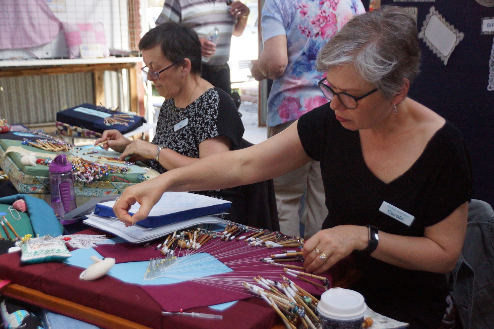 Concentration ... Pat and Carole from Rich River Lace Makers demonstrate the delicate art of lace making.