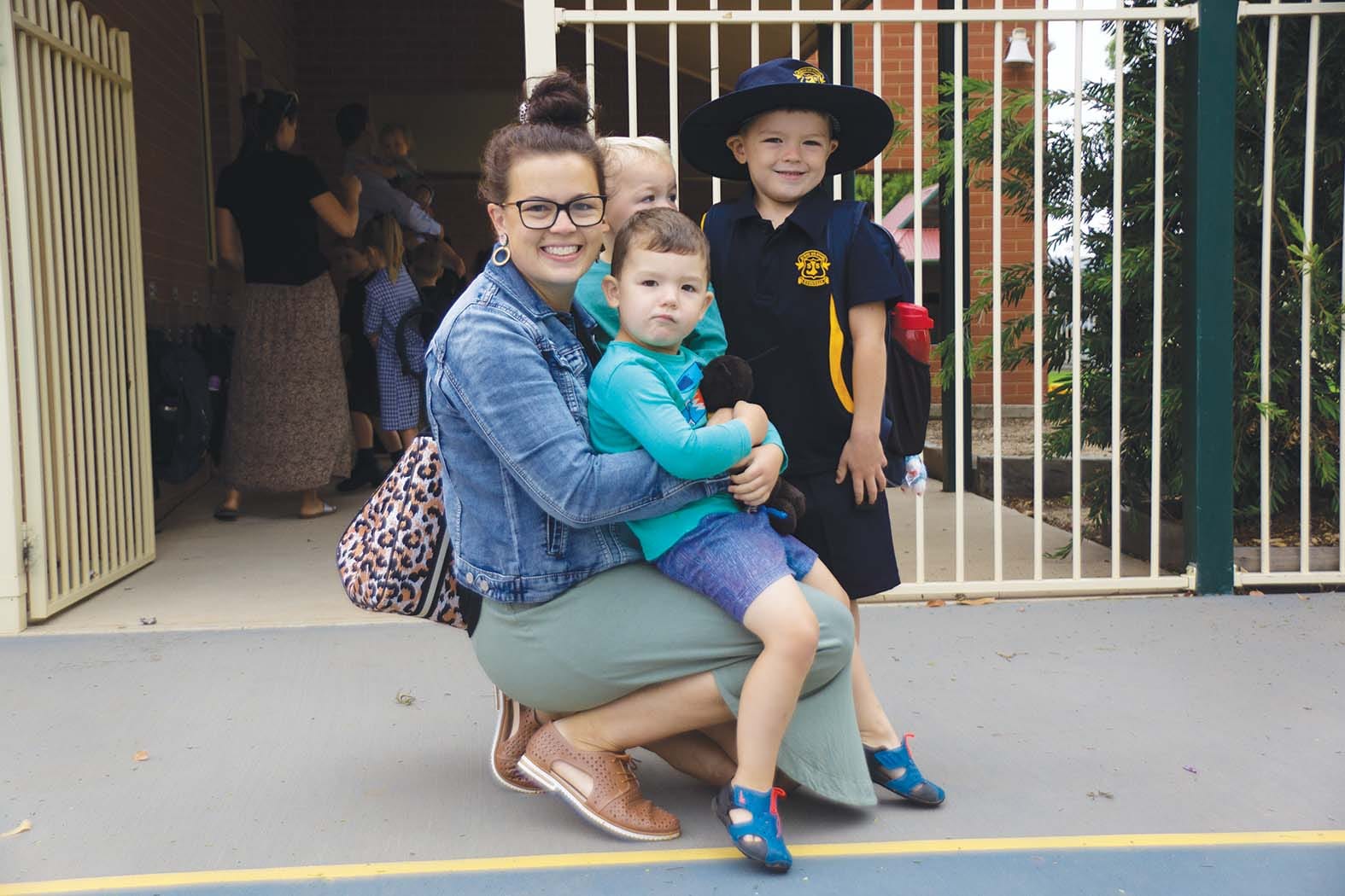 First one out ... It was a big day for the Tilley family as eldest son Oliver, pictured with mum Jody and brothers Spencer (back) and Archer, started school. 