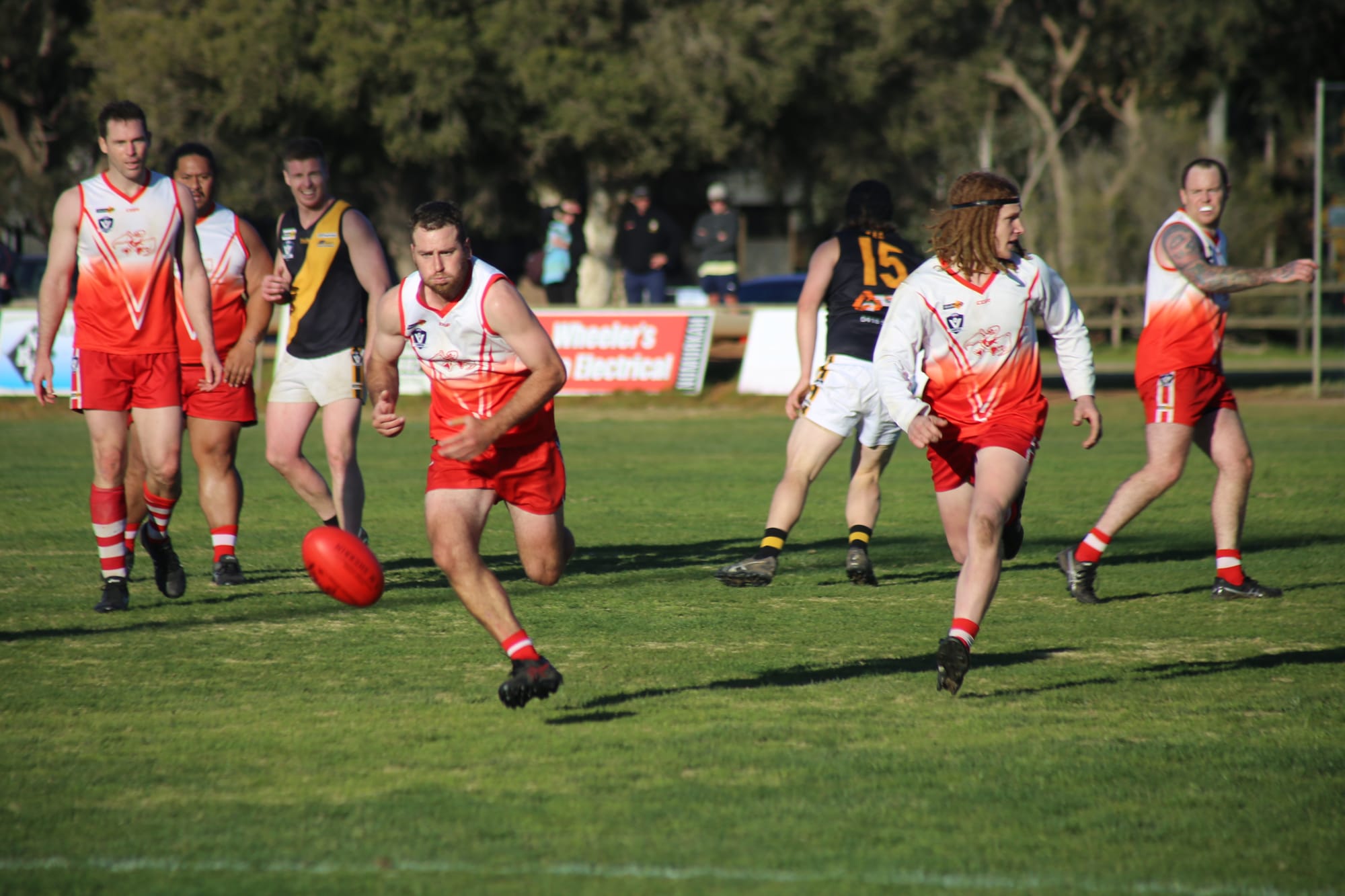 In pursuit... Adam Hicks hunts the ball as Harry Hill looks to shepherd.
