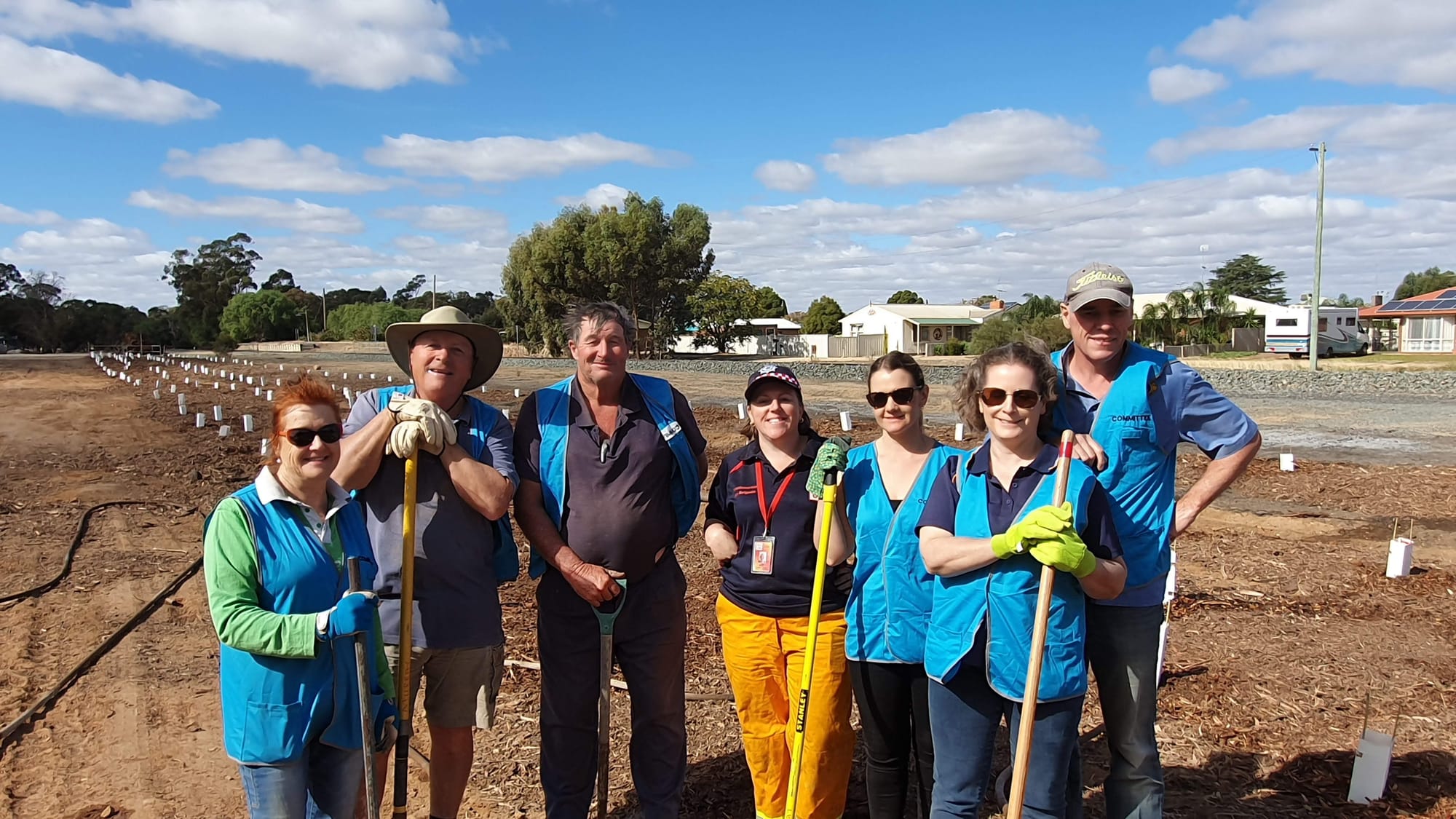 Community man ... Strathmerton community stalwart Bernard Murray (second left) with fellow Strathmerton Community Steering Committee members (from left) Kerry Murray, Phillip Ross-Soden, Allison Easden, Casey Graham, Lynda Dickson and Malcolm Dickson at the original tree planting in April 2019.
