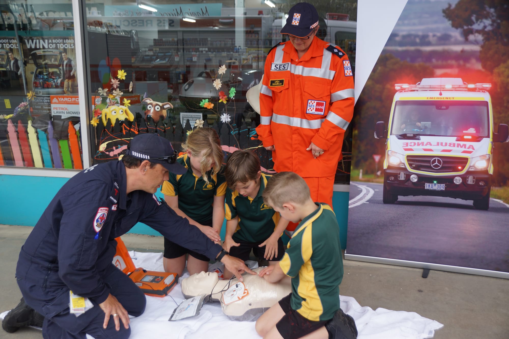 Knowledge is power ... Craig Beamish provides a few pointers to Anna Newham, Izaac Koeleman and Angus Newham on restart a heart day, as Linda Howard watches on. 