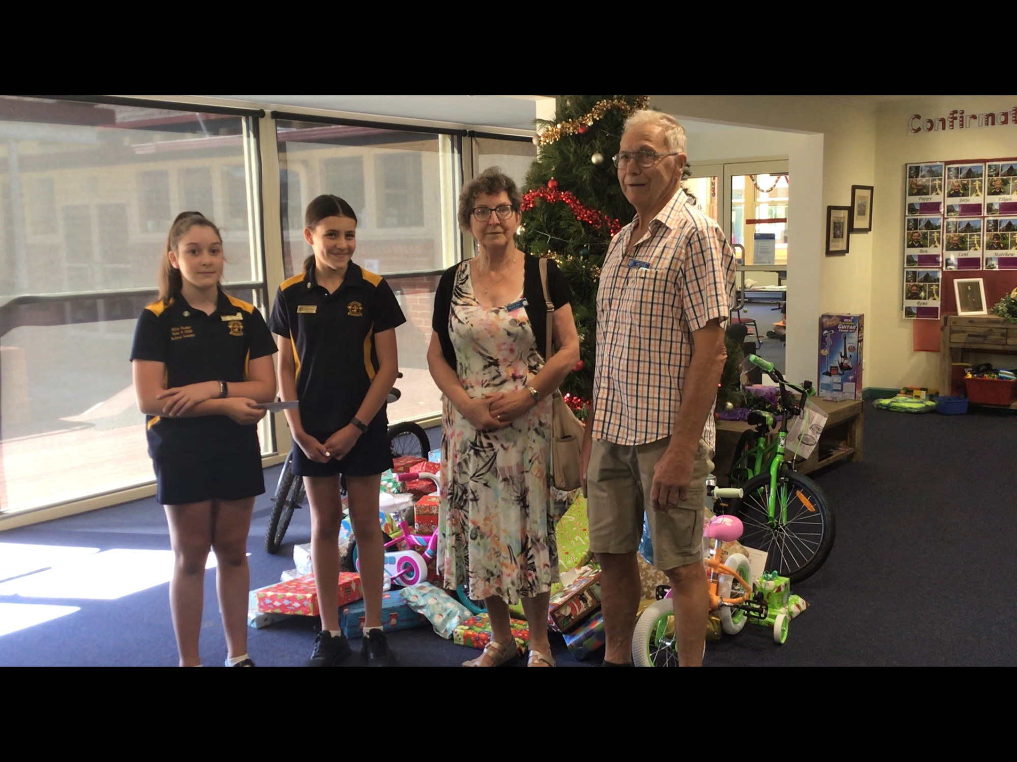 Delivering kindness ... St Joseph’s students Millie Hooker and Eva Laidlaw, with St Vinnies volunteers Francine Mezenberg and Peter Mezenberg. 