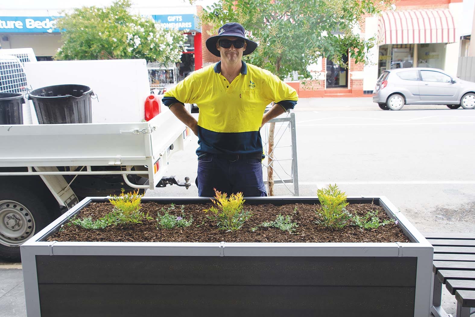 Easy on the eyes and the planet … Dave Roberts with the newly installed planter box, which is intended to be the first of many and is created from environmentally sustainable materials. 
