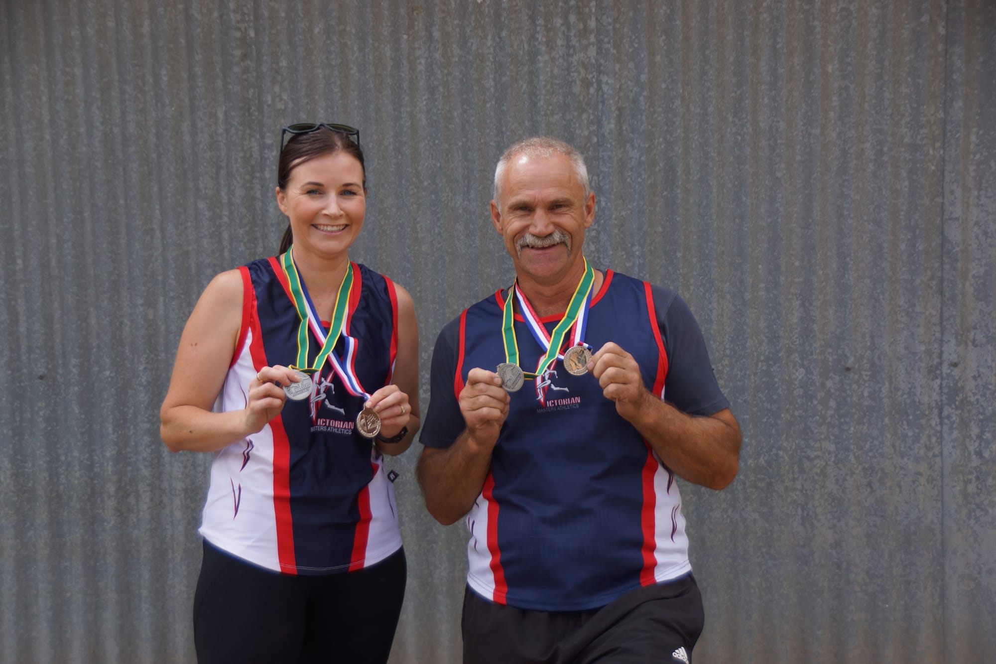 Masters of the art ... Amy Cooper and Doug Cobbledick with their Masters medals. 