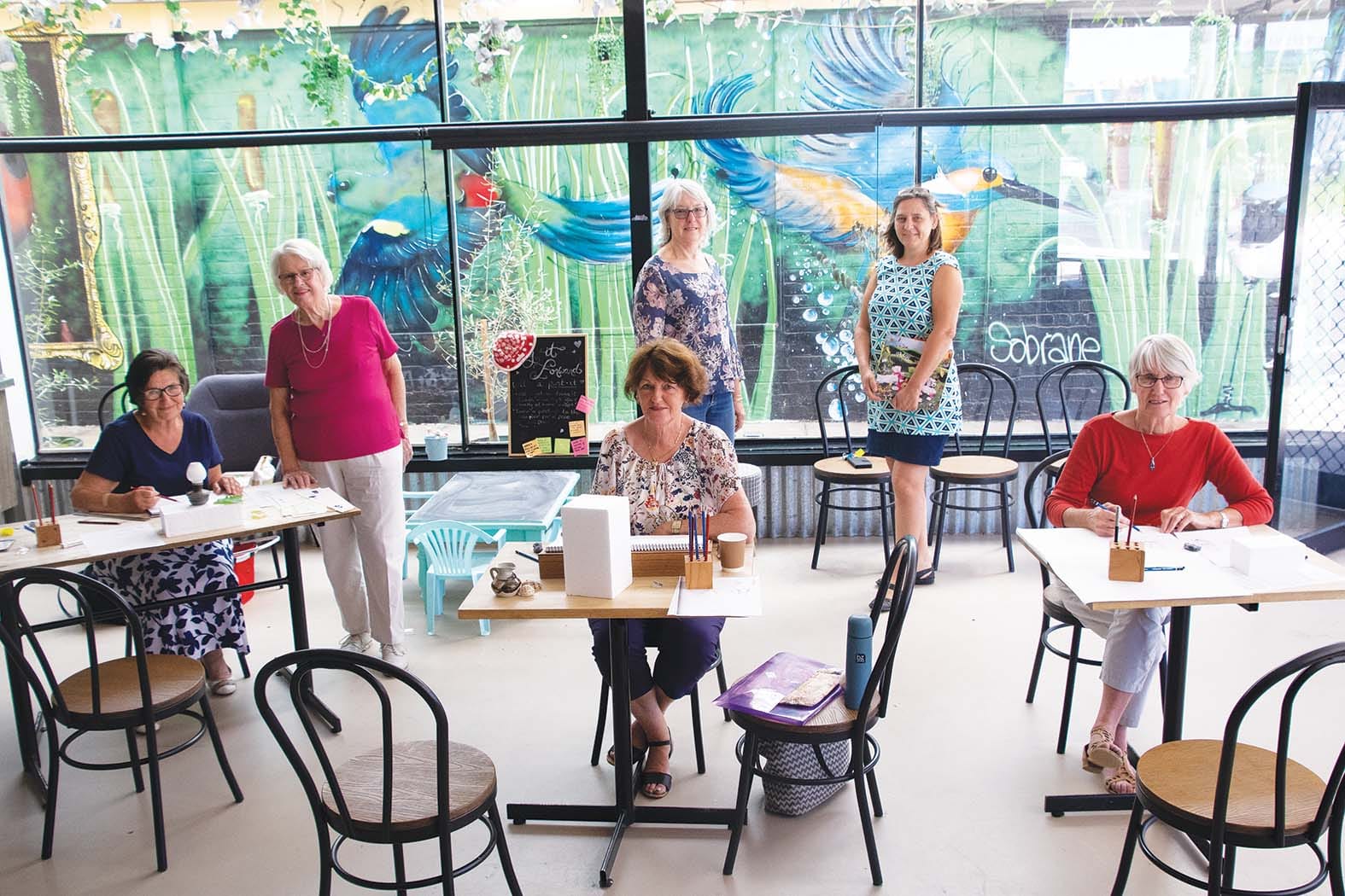 Art in action... (Front from left): Sharolyn Morris get some tips from teacher Bev Williams, while fellow aspiring artists Mary Chantwell and Nance Taylor practice new skills while CAN Hub founders Barb Sinclair and Jacqueline Cuijpers watch on.