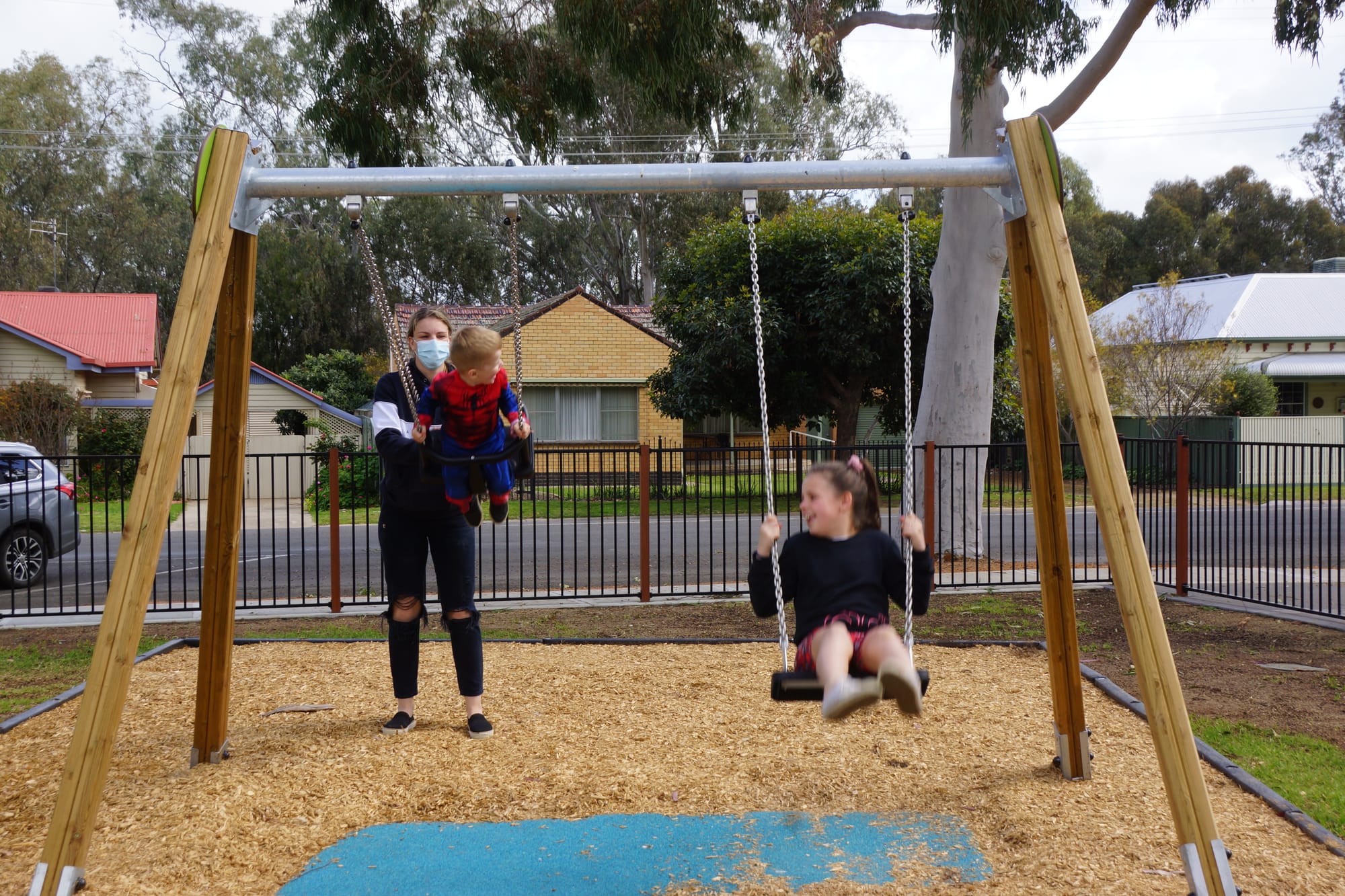 Spiderman likes to swing... Kaiden and Lily Sidebottom, along with mum Gemma McGaw, love the variety of equipment in the upgraded playground. 
