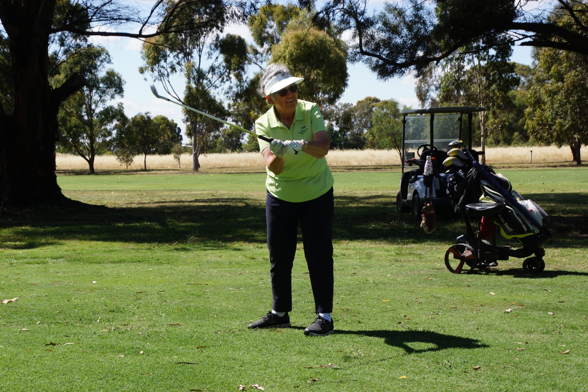 Get on... Liz Dell chips onto the green on the par three fourth last Wednesday. 