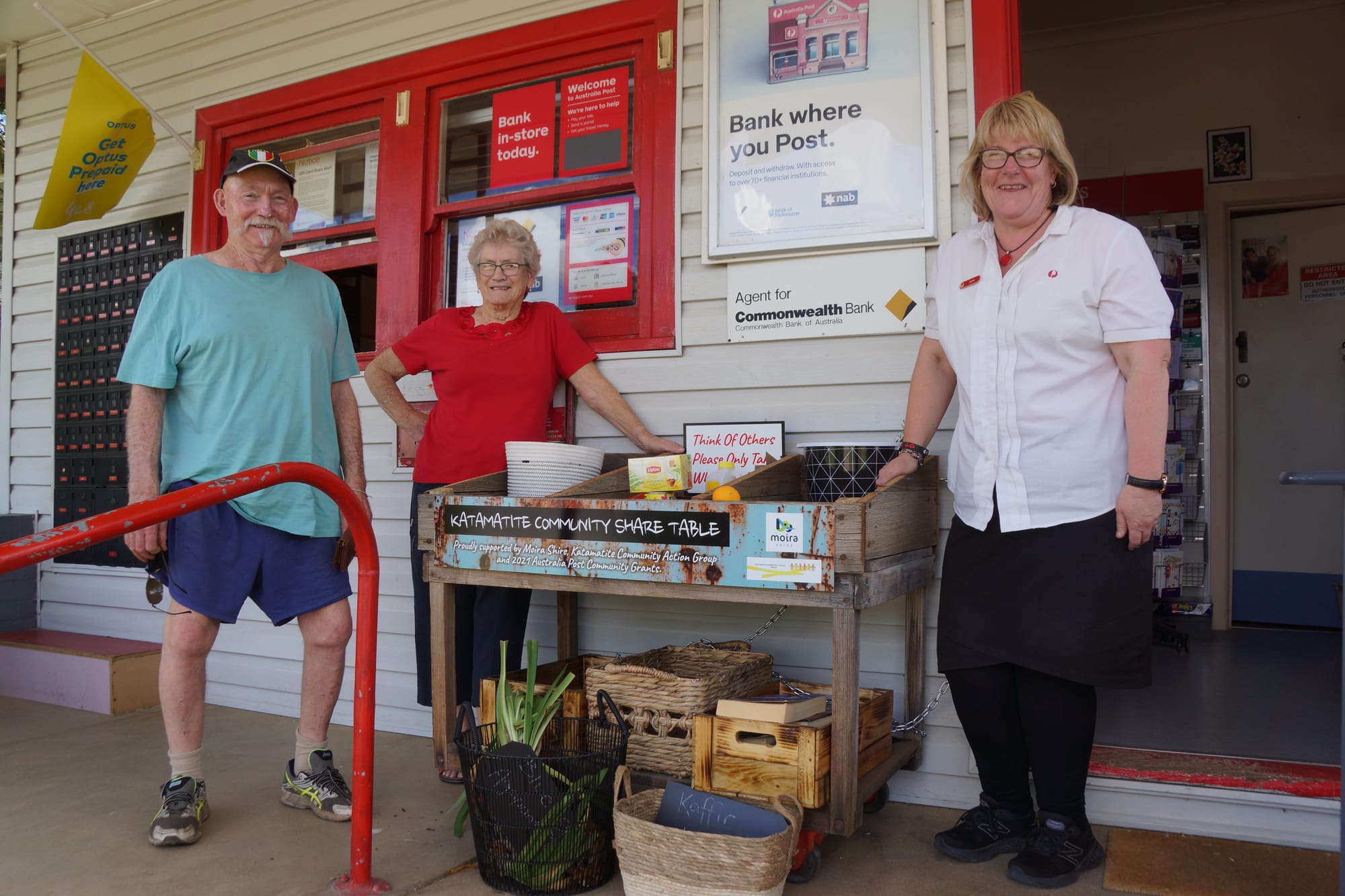 Helping hand... Community members (from left) Rob Staggard, Marjoire Mansell and June Wood at the community share table. 
