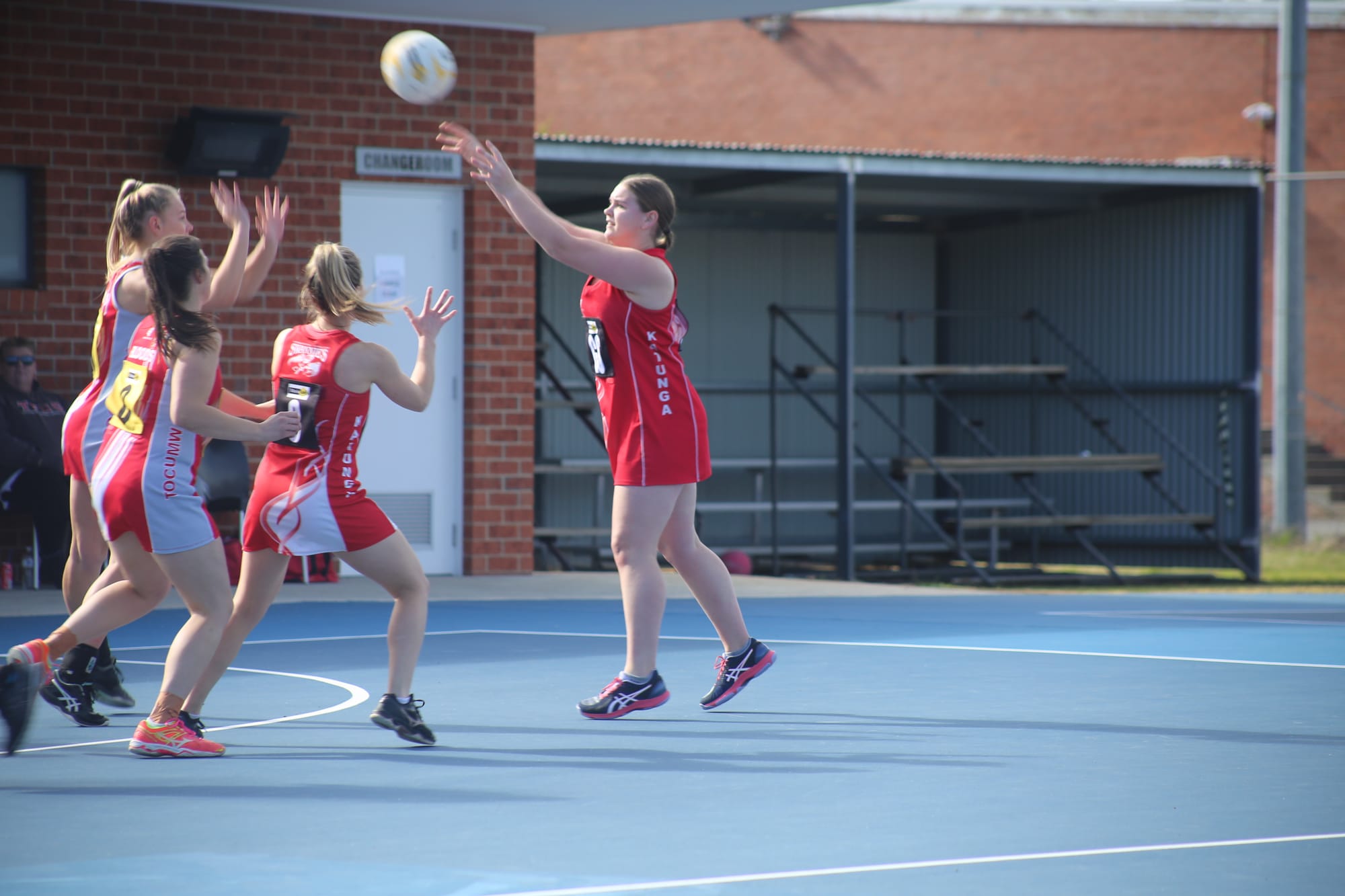 Over the hands ... Breanna Armitage steers a ball into the goal ring for Katunga. 