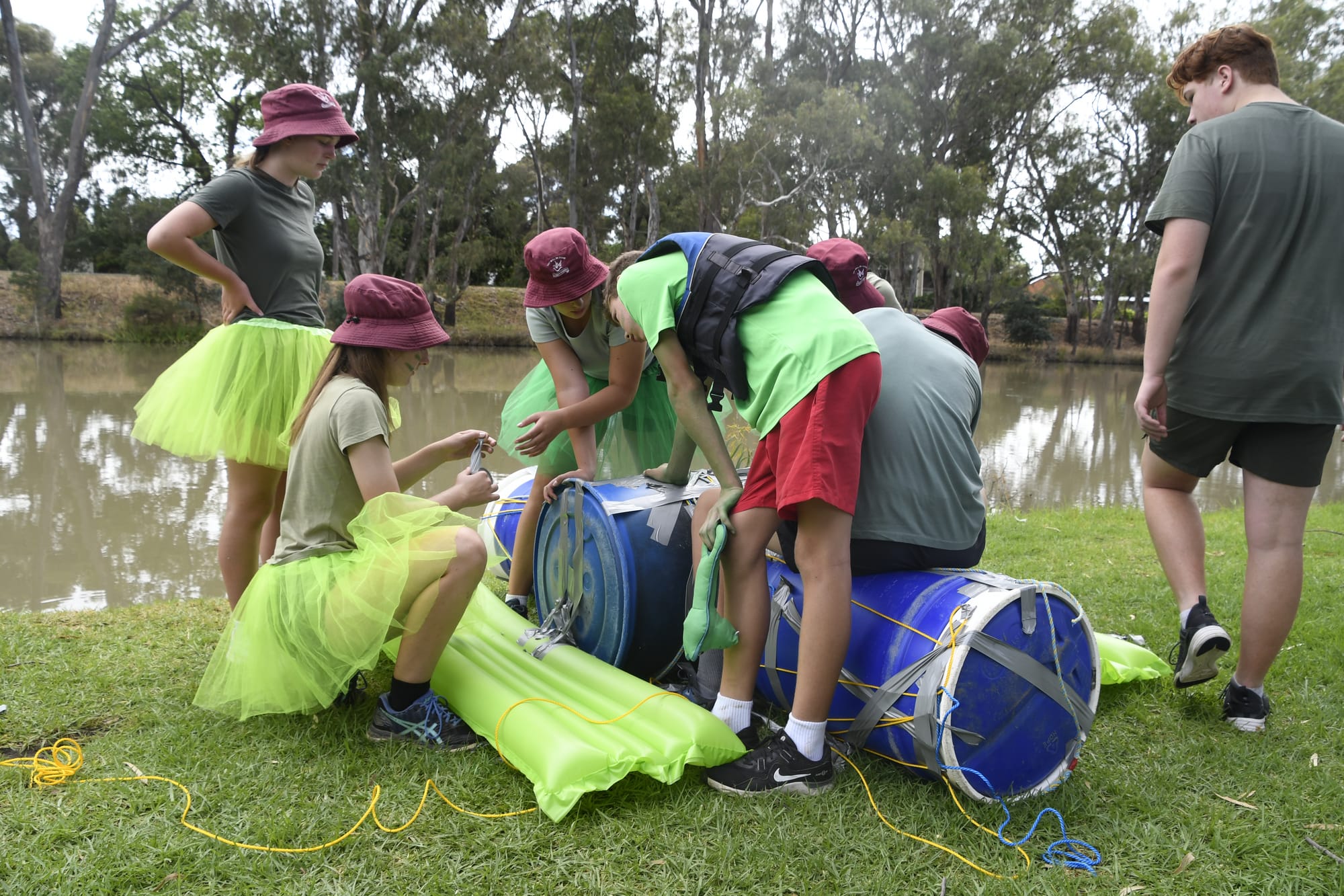 Taping up ... Teams had to work together to build a raft that would be sturdy enough to get across the creek. 
