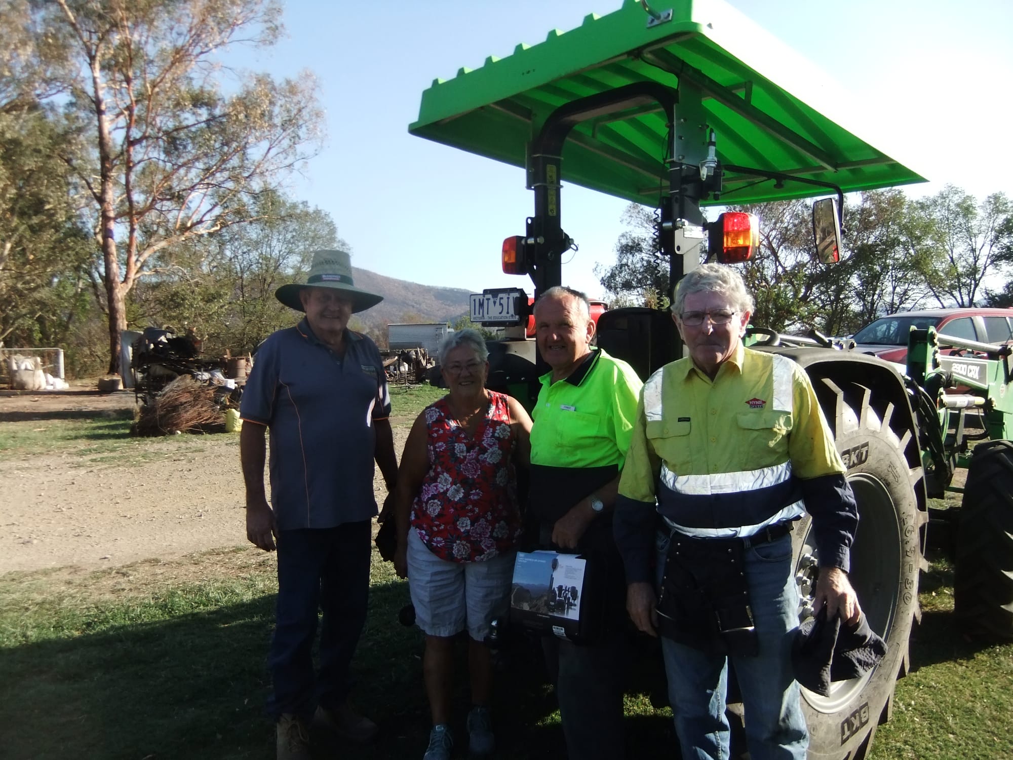 Team work ... Cath and Forest Stanyer (centre) with fellow fencing volunteers helping to rebuild fences destroyed in the Corryong fires.