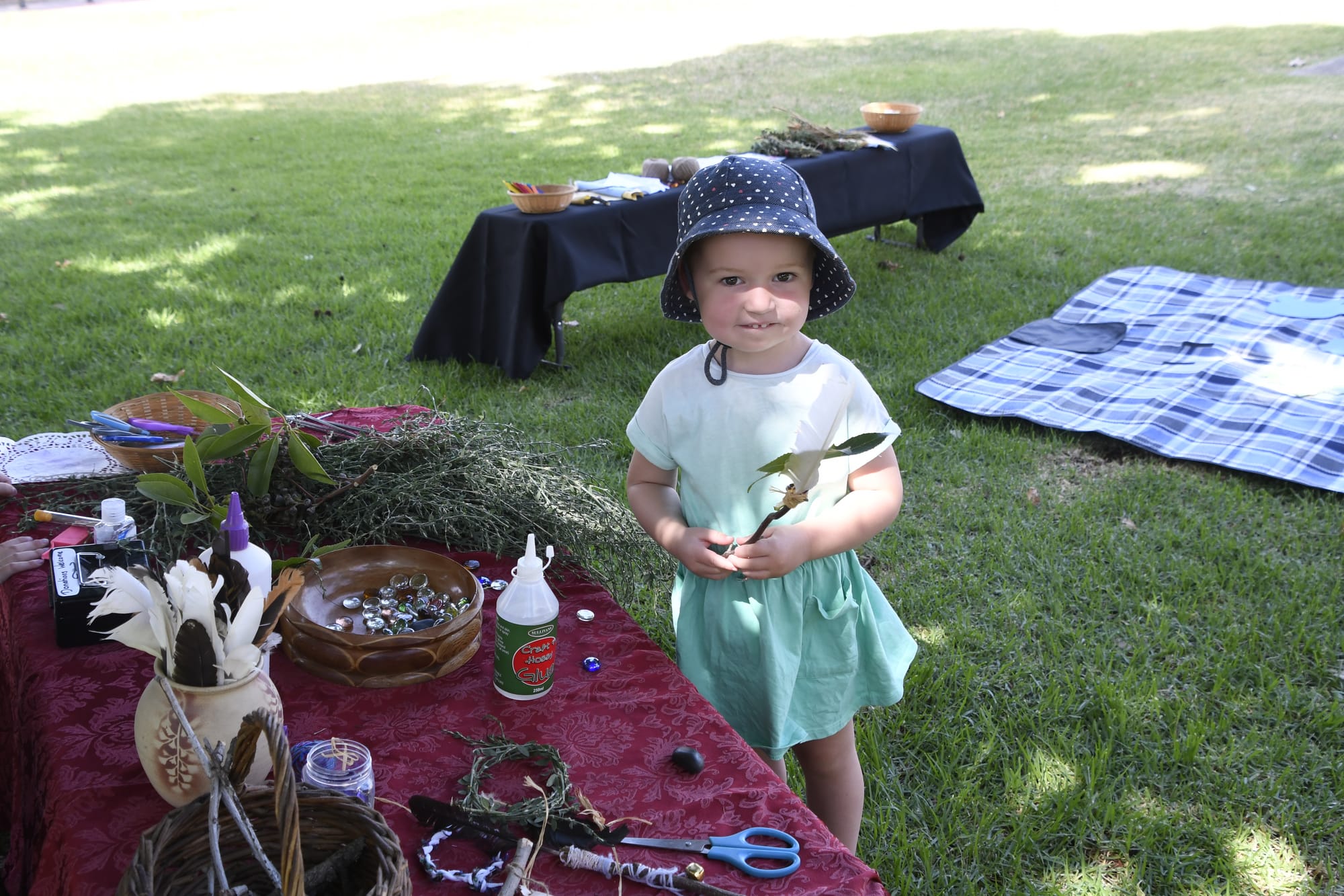 Magical fun ... Lily Armstrong had a great time making magical wands from simple materials at the art in the park event.