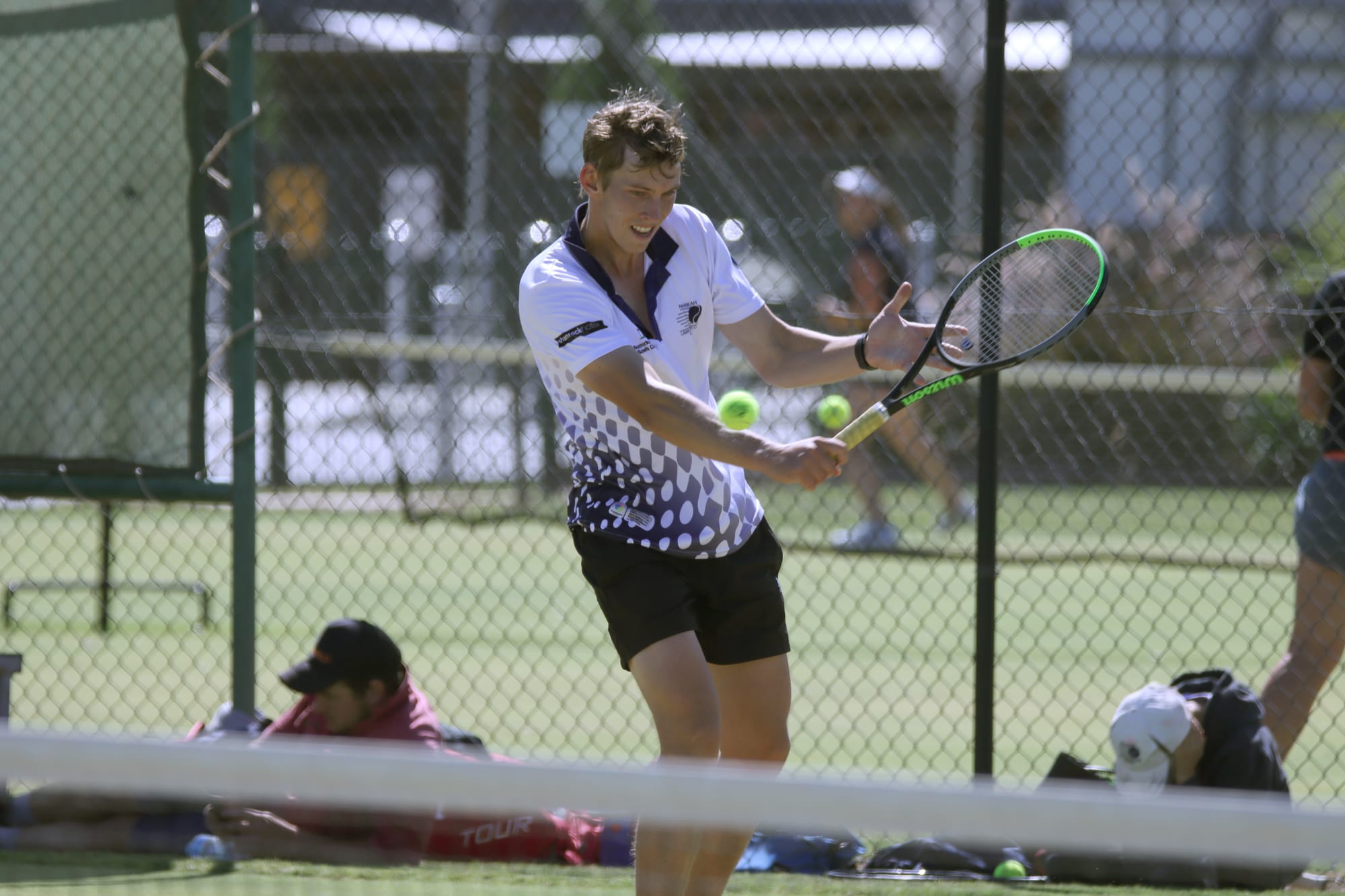 Lost his hat ... Brayden Price returns a shot back over the net in the Raiders’ win on Saturday.