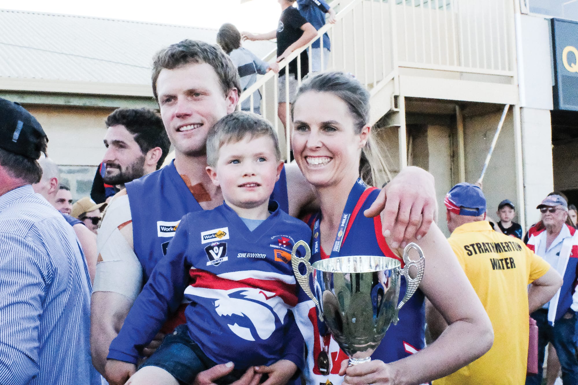Family affair … Michael and Kelley Laidlaw share their dual premiership
glory with son Ernie.