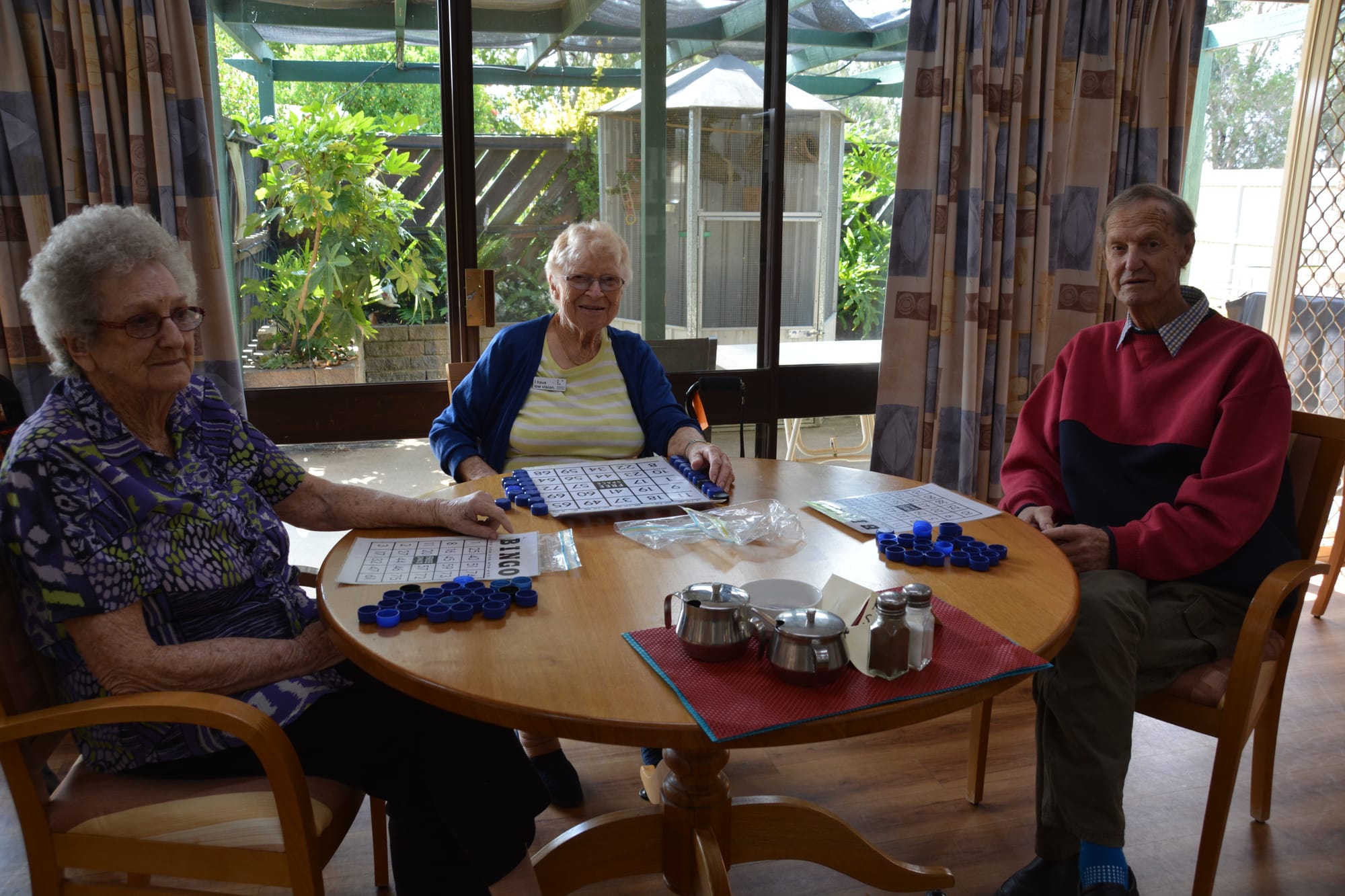 Plenty to keep them busy ... (From left): Pat Pocknee, Betty Garner and Garnard Boyd enjoy a game of bingo.