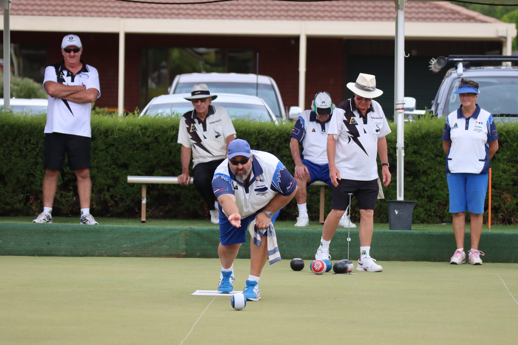 On the other side ... Gav Parkinson sends a bowl down the golf club greens on Saturday.
