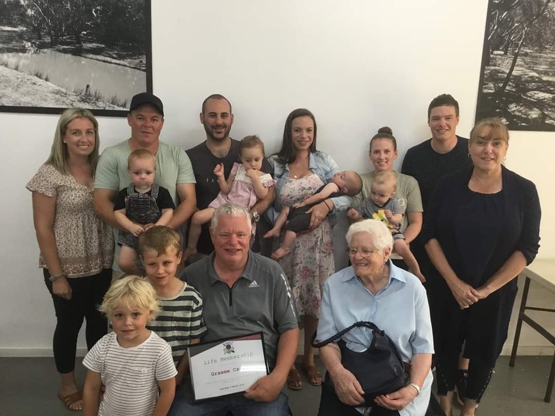 Lifetime commitment ... Graeme Carey with family members after his life membership presentation.