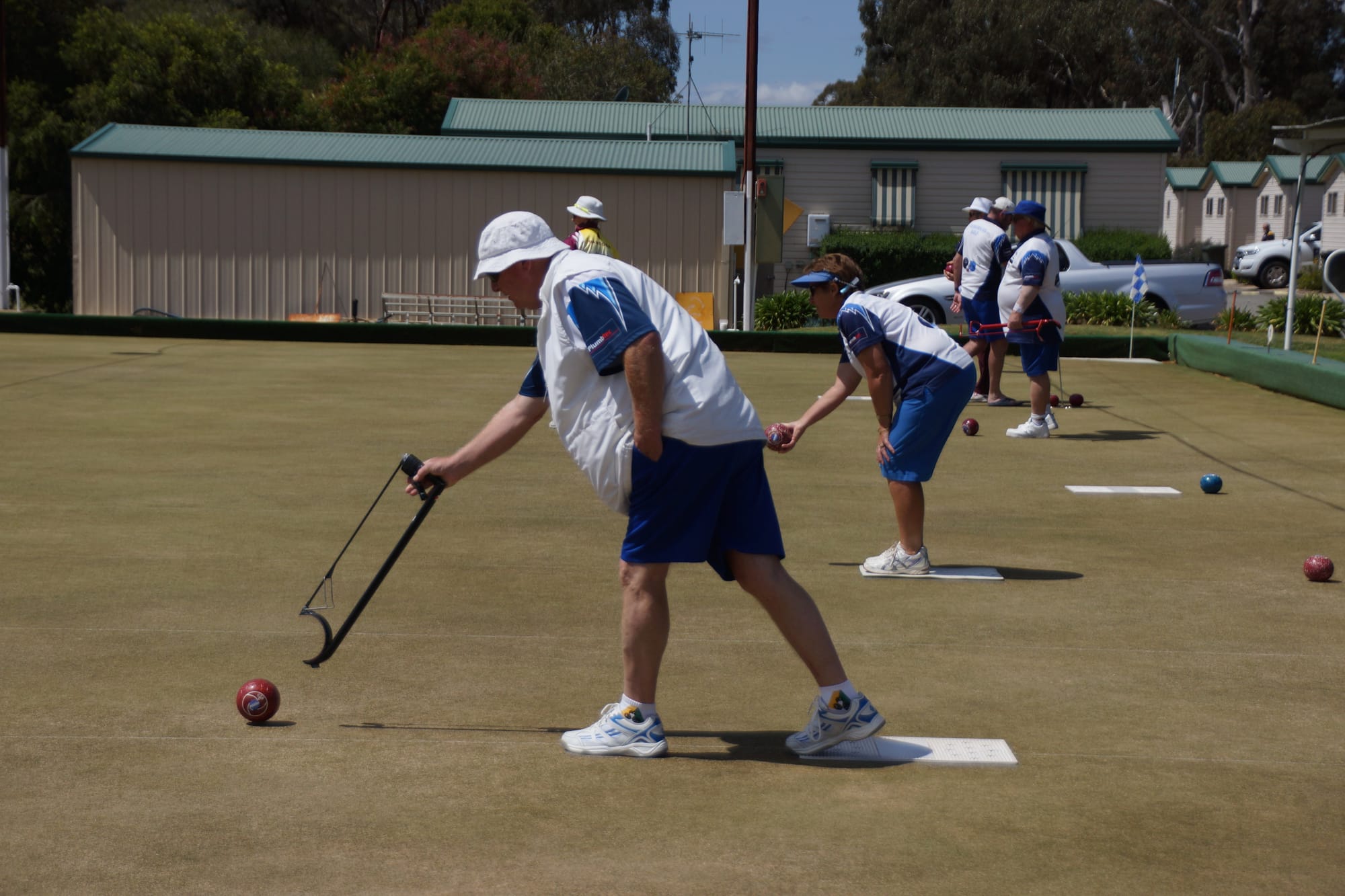 Synchronised bowling ... Ron Pickersgill and Loris Houlihan get their bowls away on Saturday.