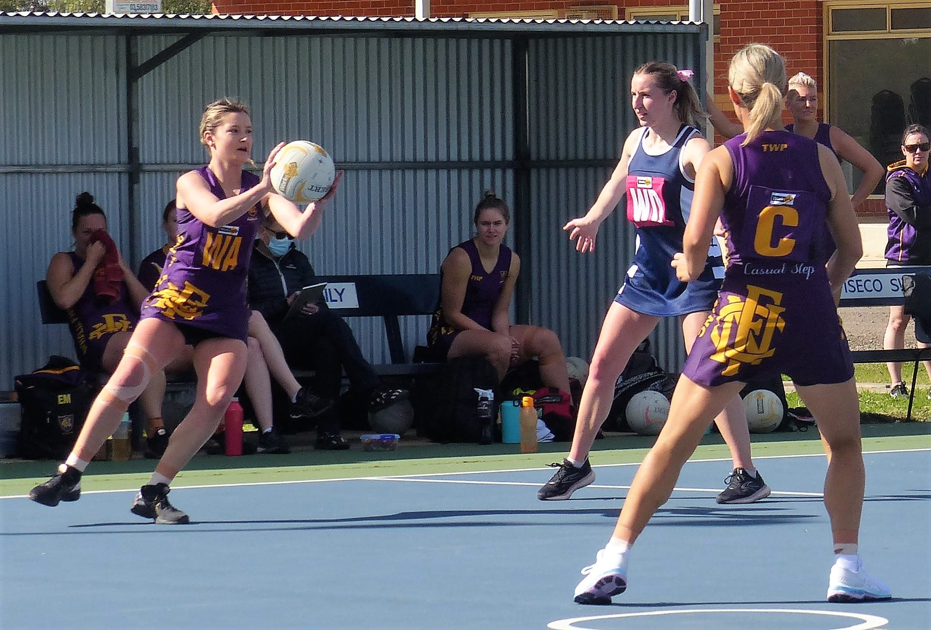 Another win... Stacy Ross catches a ball in the mid court, with Emma McDonald waiting for a pass next to the centre circle. 