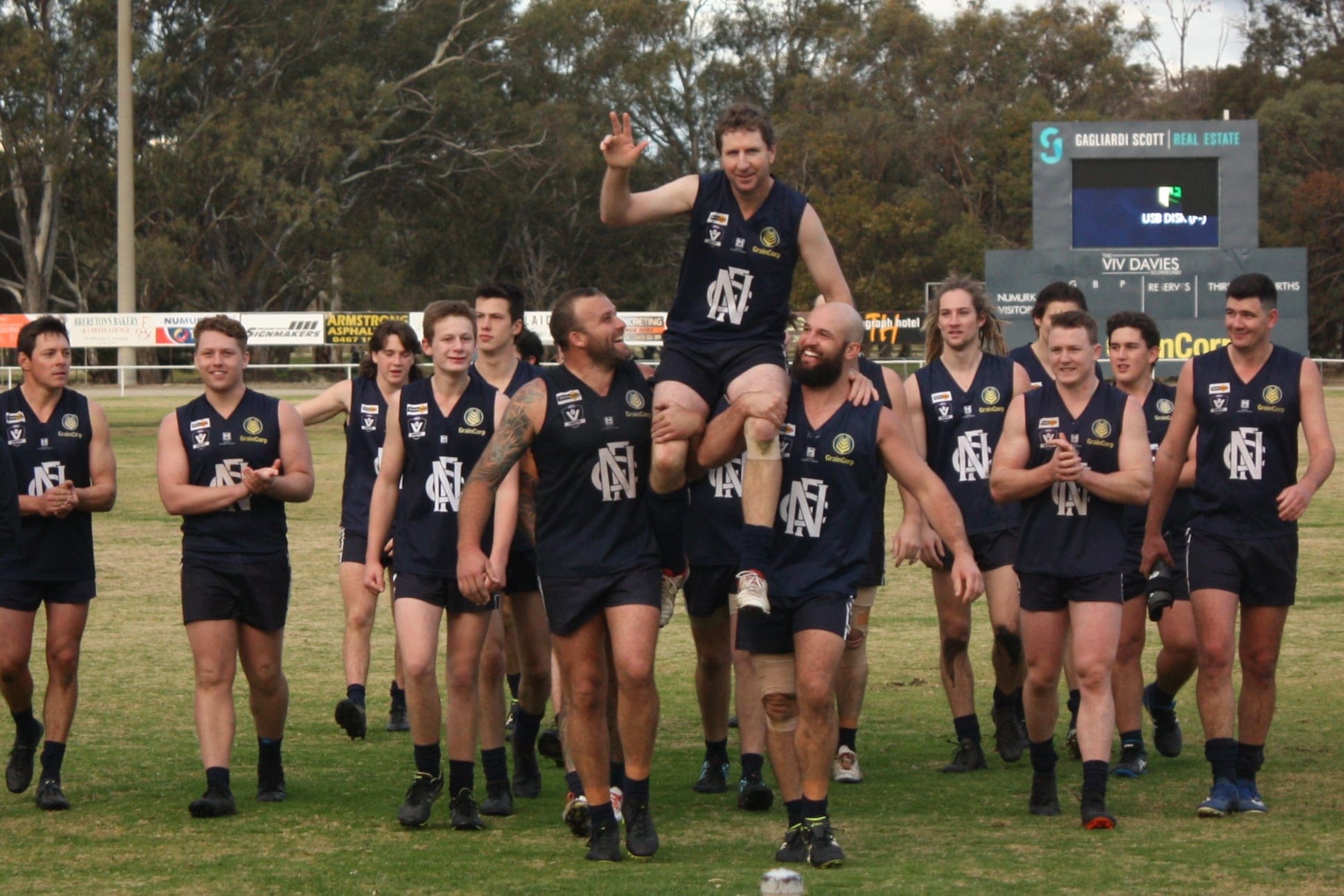 Club legend ... Nathan Hicks (left) and Ben Wellington chair Pisto off after the game. 

