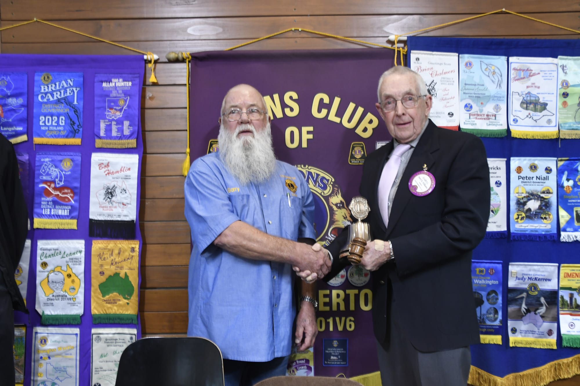 Smooth changeover ... Outgoing Strathmerton Lions Club president Garry Smith (left) hands the gong over to new president, Daryl Williams. 
