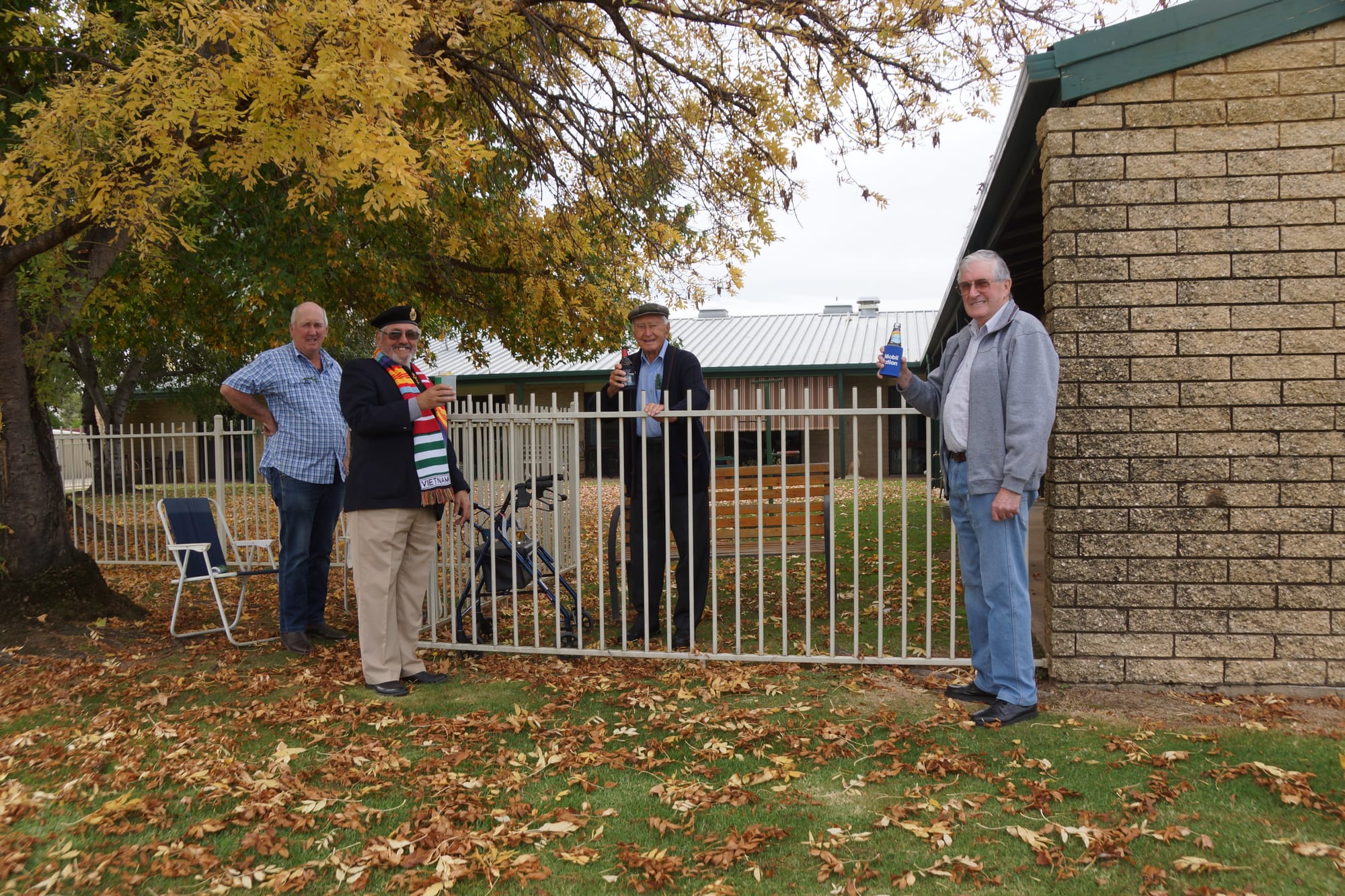 Tradition ... John Lycett, Geoff Stanyer, Ron Monk and Harry Baker raise a toast to our service people outside Pioneers Lodge.