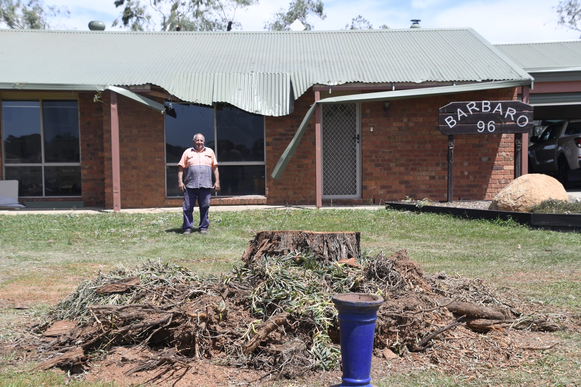 Lucky escape ... Frank Barbaro is thankful that the tree that used to be in his front yard wasn’t planted closer to the house.
