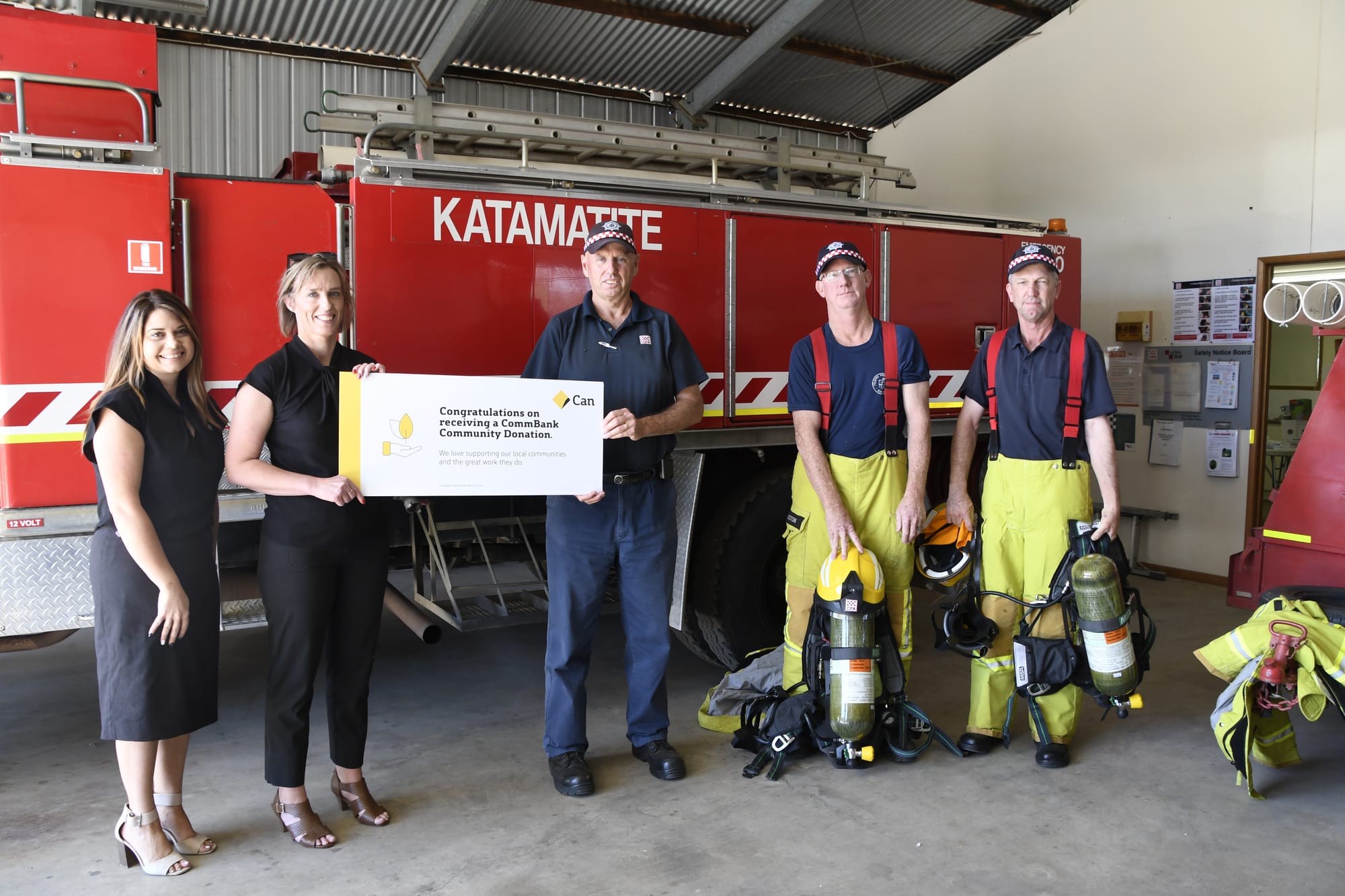 Happy with the new gear and the support ... Melanie Mustica and Rachel Cartwrite from the Cobram Commonwealth Bank branch were happy to present John Parnell, Jason Millington and Stephen Dickie from Katamatite CFA brigade with a contribution towards the cost of the new BA units. 