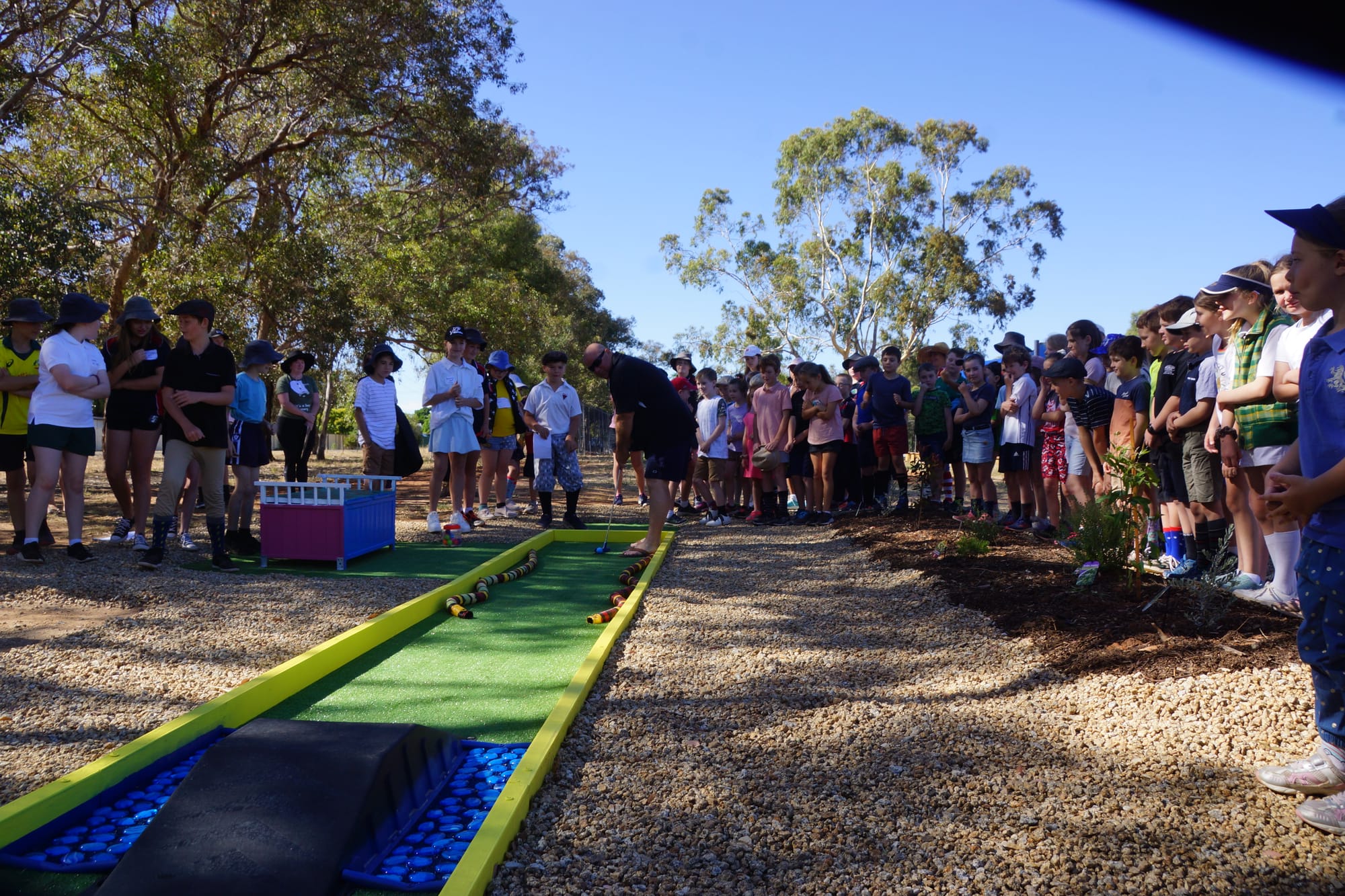 First shot ... Neil Fry built most of the hole, so the kids decided he had to be the first one to have a go. 