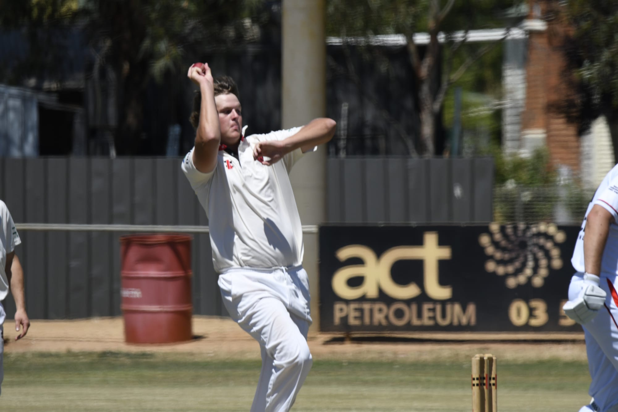 Right arm over ... Hayden Hixon took the key wicket of William Baker. 