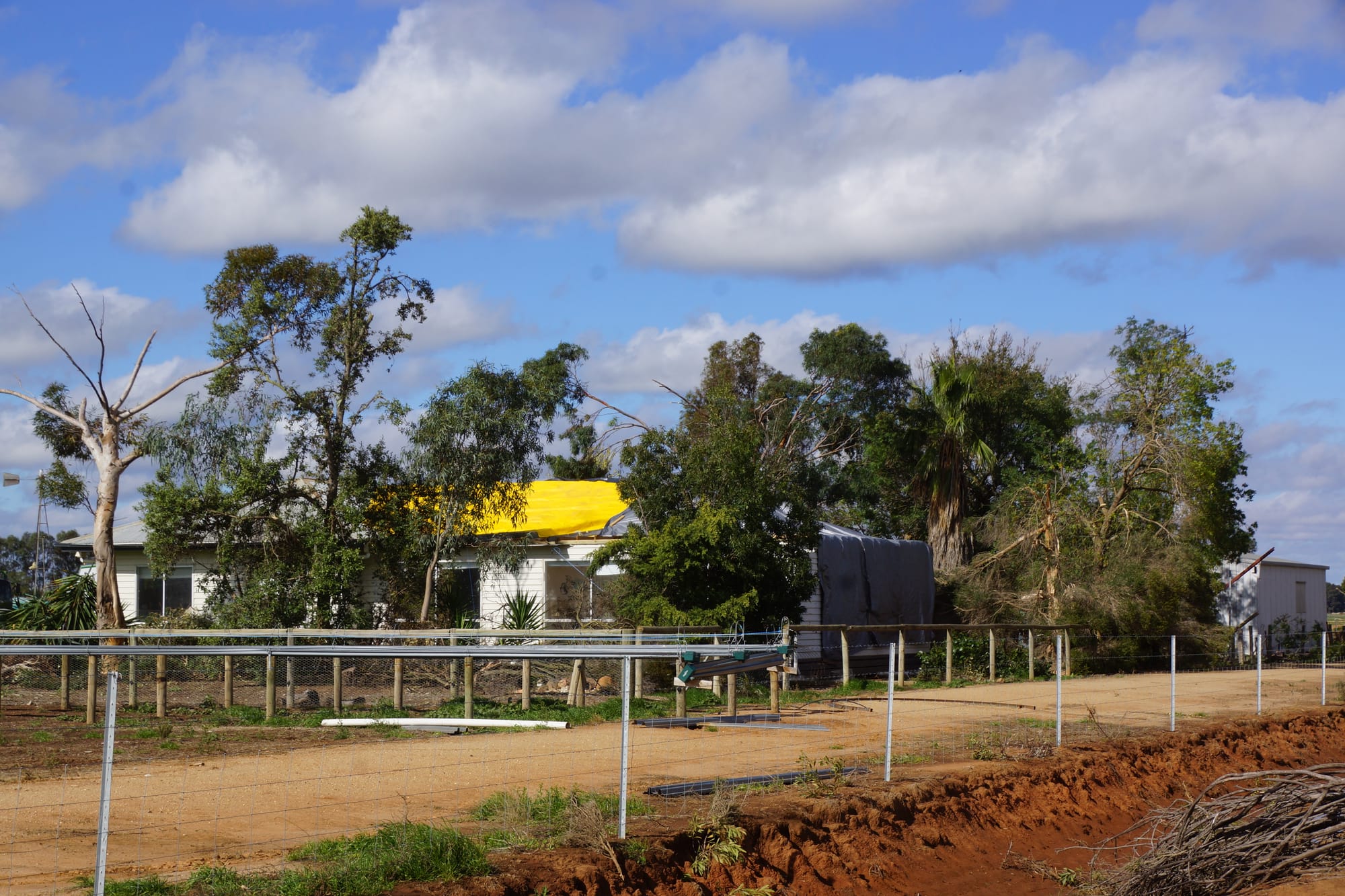 Tarps tell the tale ... This home on Pinnucks Road Katunga was left uninhabitable after strong winds tore off sections of its roof and side. 