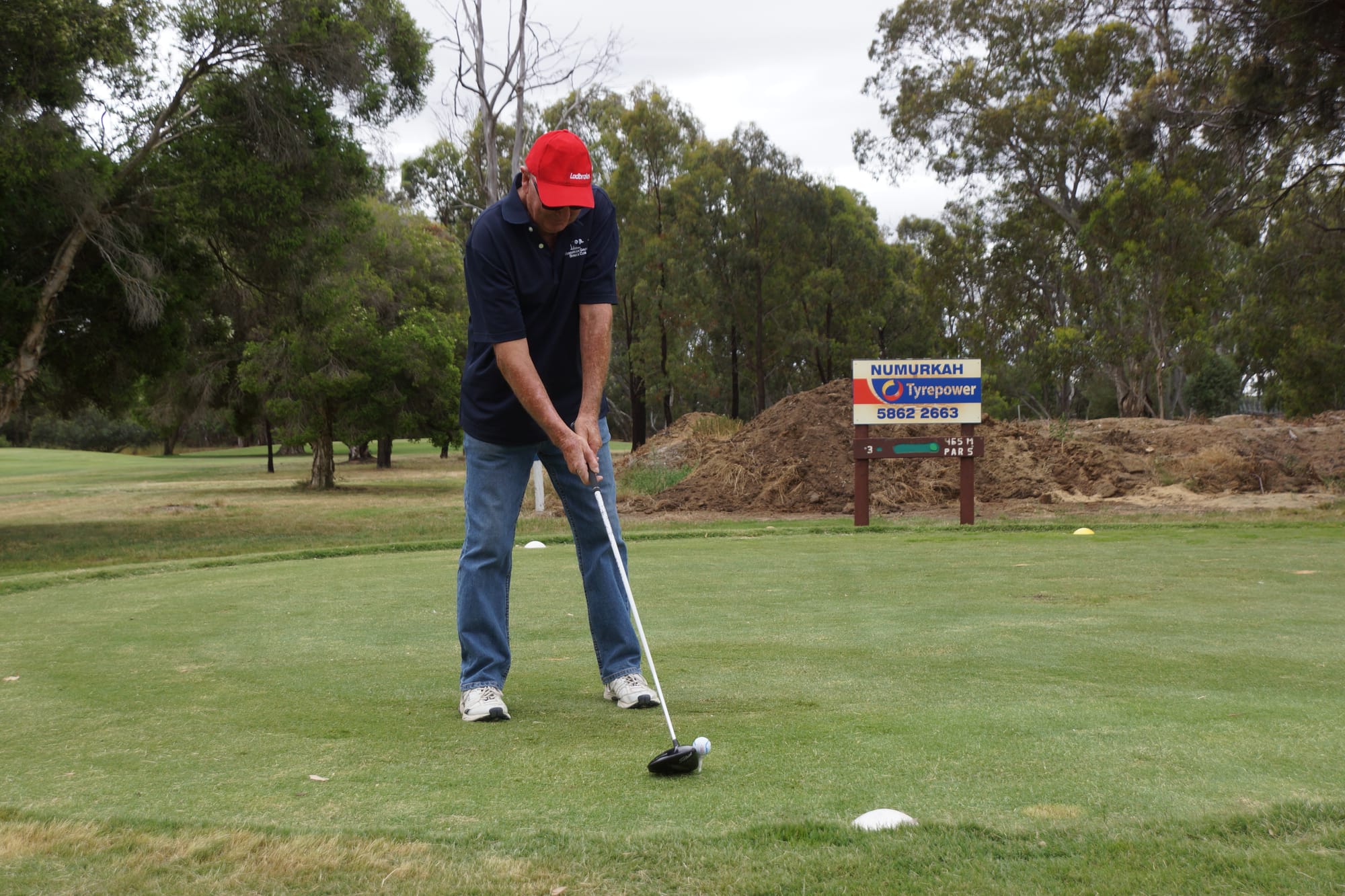 In form... Bruce Collins hits his second shot on the par five third last Thursday. 