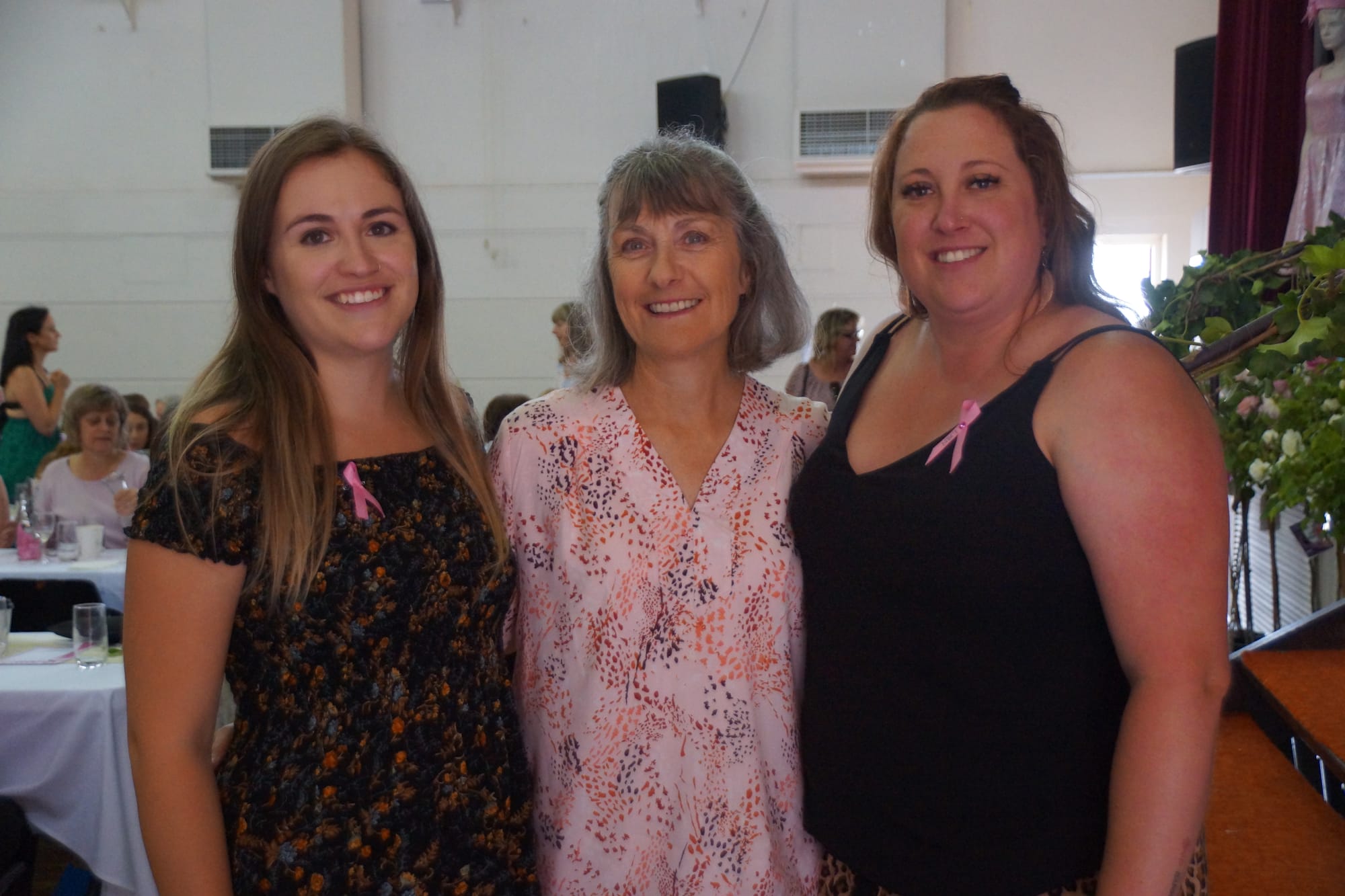 Not taking it lying down ... Guest speaker Hayley Clark (right), with sister Meg Storey and stepmum Robyn Storey, knows what a long shadow breast cancer can cast.