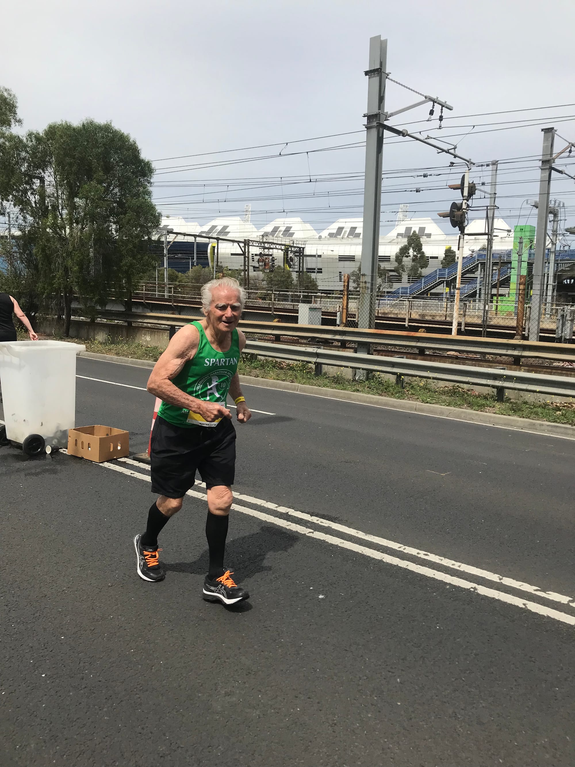 Running man ... Barry chewing up the miles in the Melbourne Marathon on Sunday, accompanied by grandson-in-law Alberto Fernandez and great-grandson Benji Fernandez.