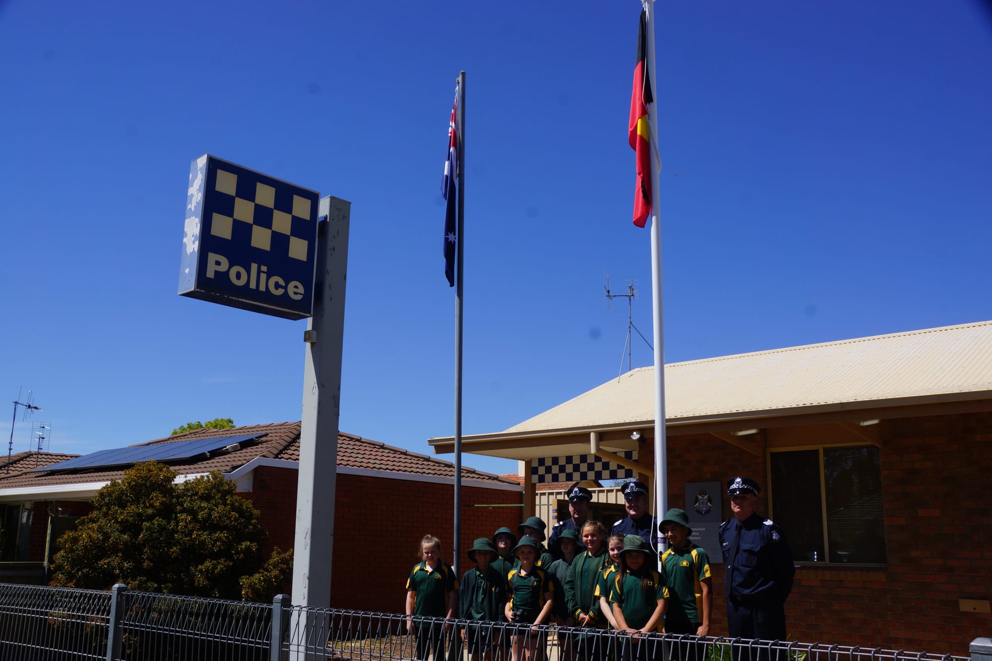 Proud ... Local police members and Numurkah Primary School students welcome a new era together.